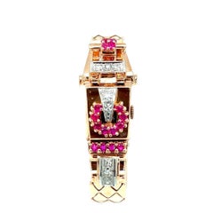 Reloj manual retro de oro rosa, diamantes y rubíes