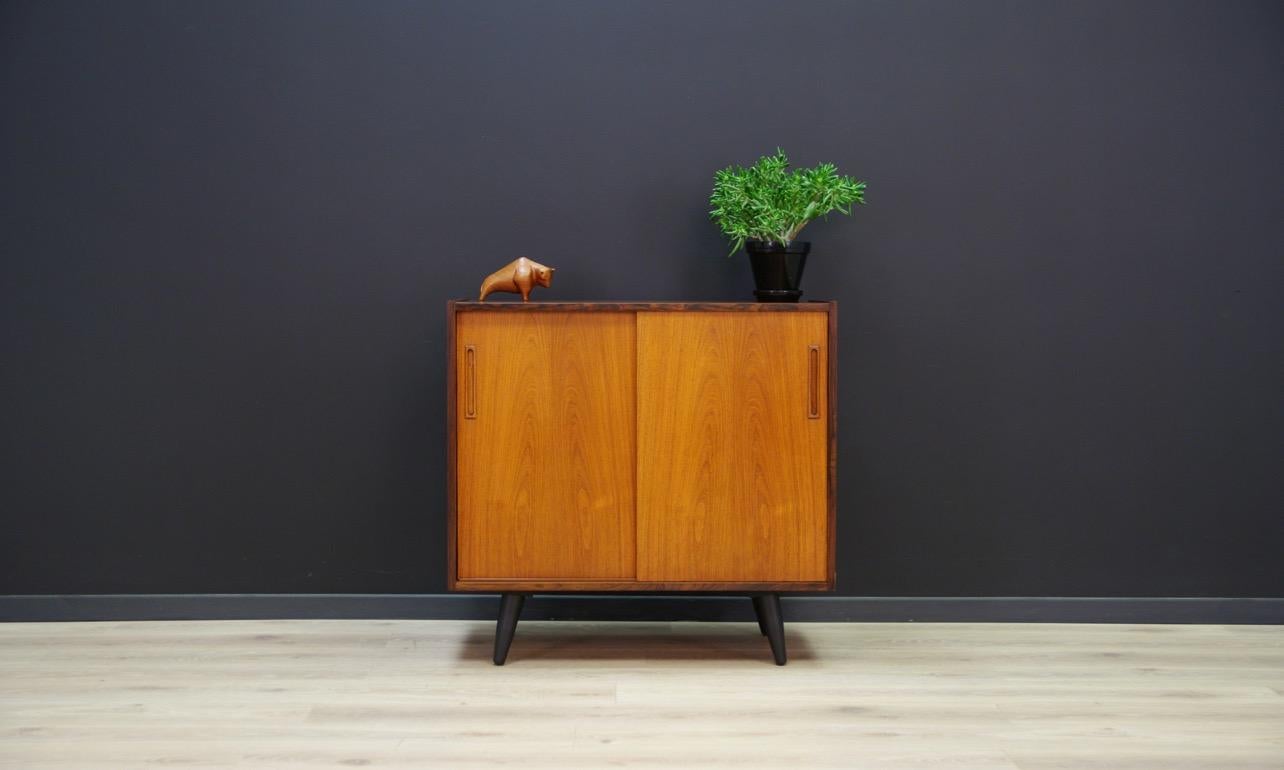Original cabinet from the 1960s-1970s, Minimalist Danish design. Furniture veneered with rosewood. In the interior, behind the sliding door there is a shelf. Preserved in good condition (small bruises and scratches) - directly for
