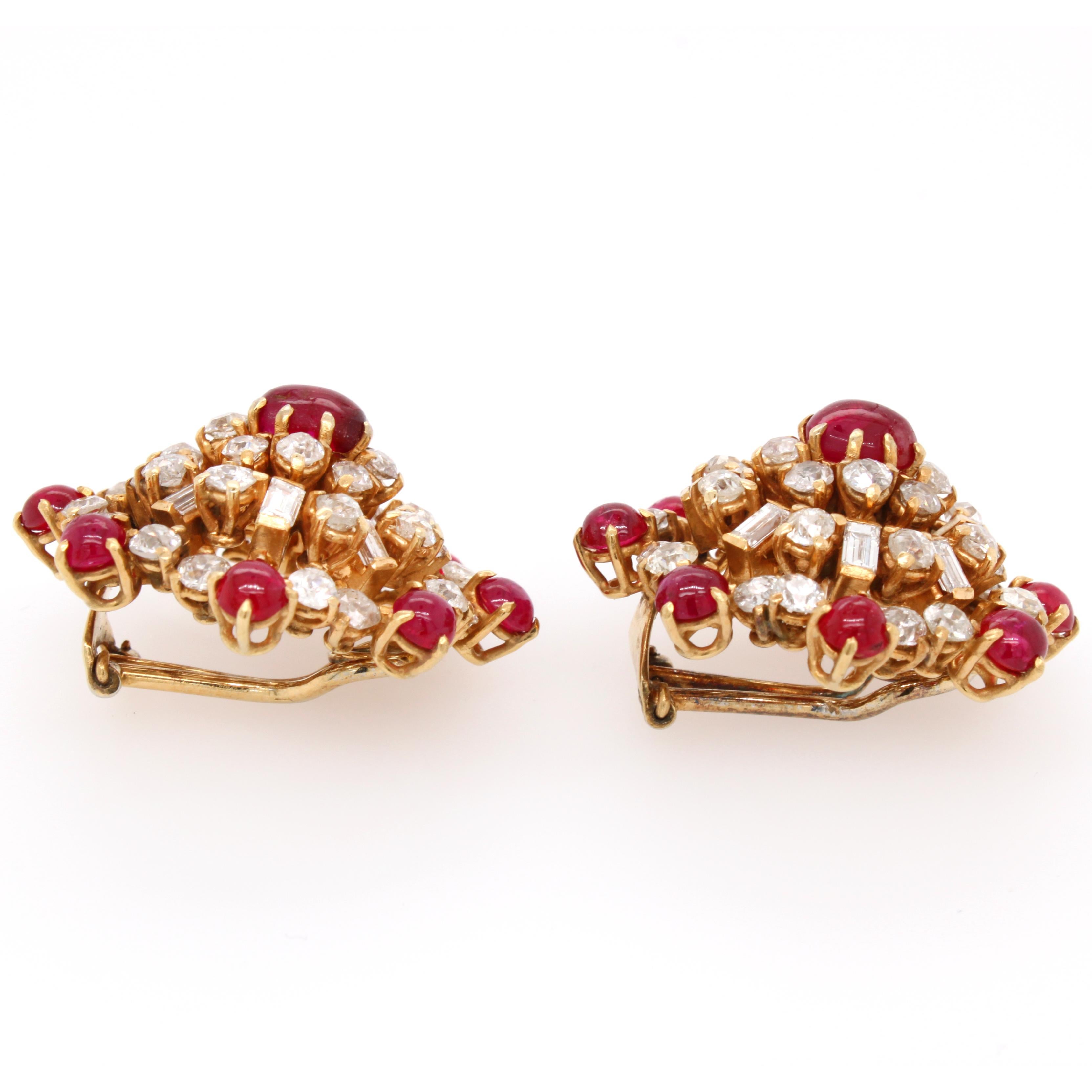 A pair of smart and wearable circular Retro earrings with ruby and diamonds, ca. 1950s. The rubies are cabochon rubies with an intense red colour, weighing approximately 6 carats. The diamonds are old European cut and baguette cut diamonds, weighing