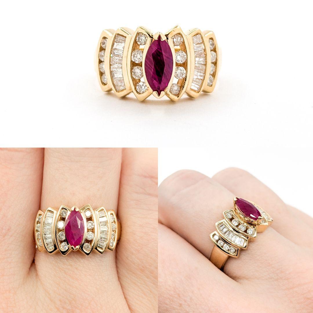 Retro Ruby & Diamond Cocktail Ring in Yellow Gold

Introducing this beautiful ruby ring, meticulously crafted in 14k yellow gold. The ring features a captivating 0.70ct marquise cut Ruby centerpiece, complemented by 0.50ctw round and baguette cut