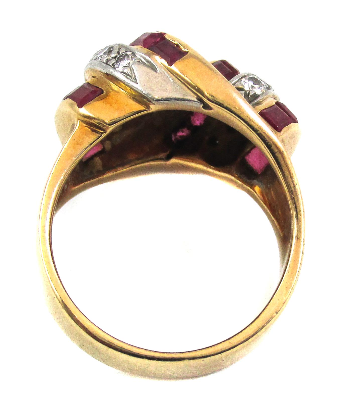 Classic Retro ring from ca. 1940 with an enchanting design of channel set Burma rubies and Old European cut diamonds. The curved design and alternating bands of red and white give this ring its unique and three dimensional look. A bold and fun