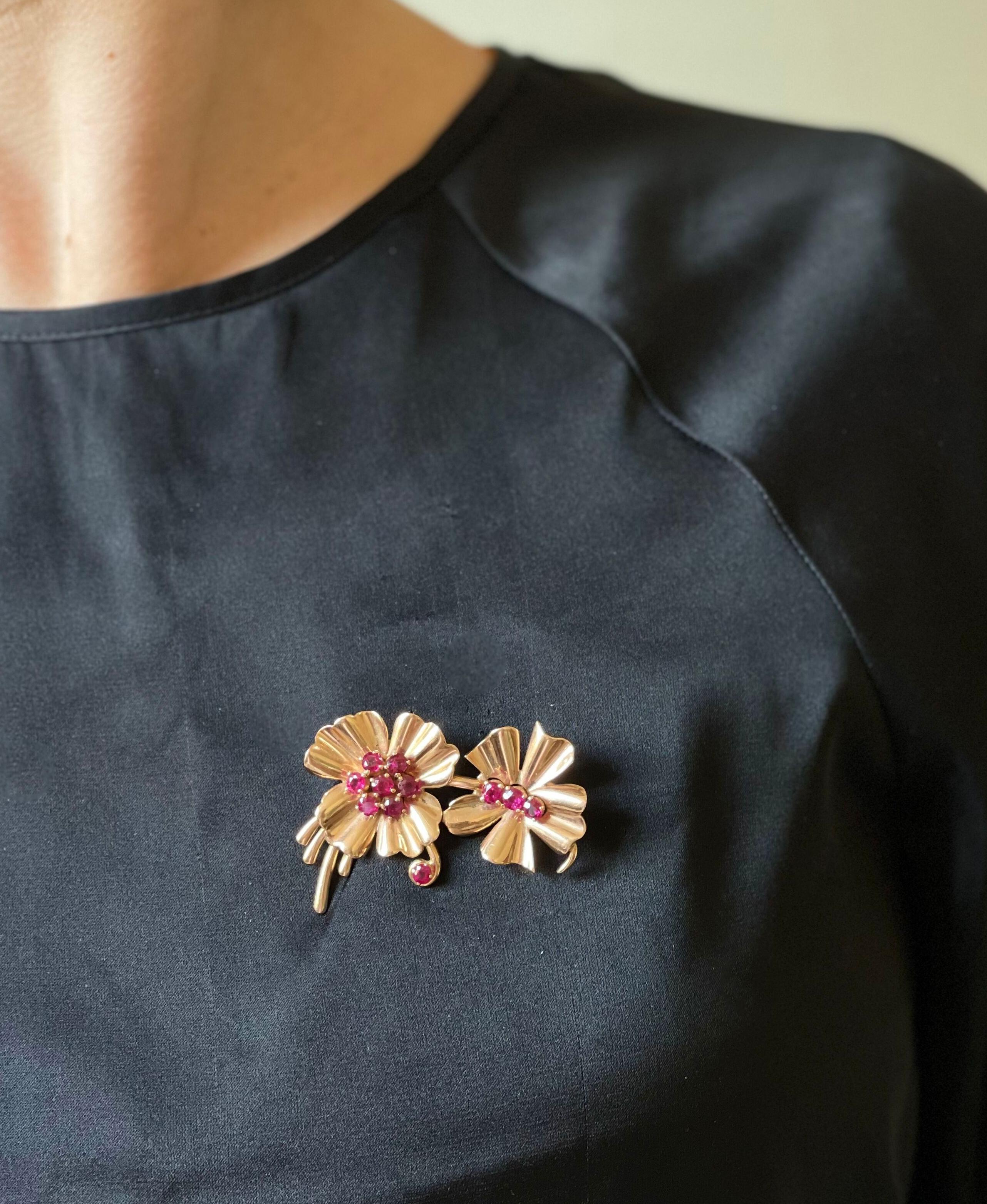 14k rose gold Retro flowers brooch, set with vibrant rubies. Brooch measures 2 1/8