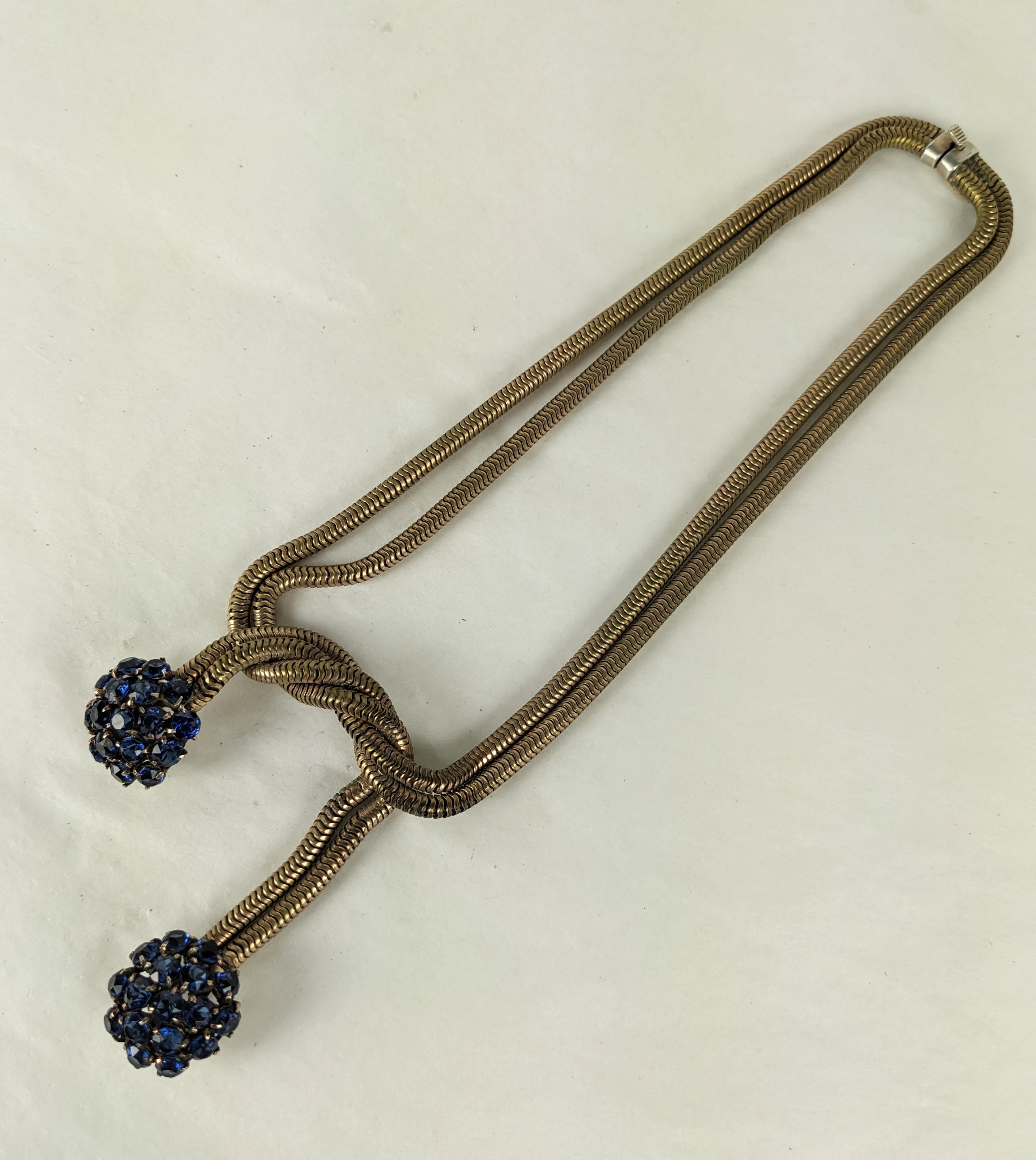 Retro Sapphire French Gaspipe Necklace with pendants of faux sapphire cluster drops. Double brass chaining with knotted design from the 1940's, France. Length 16