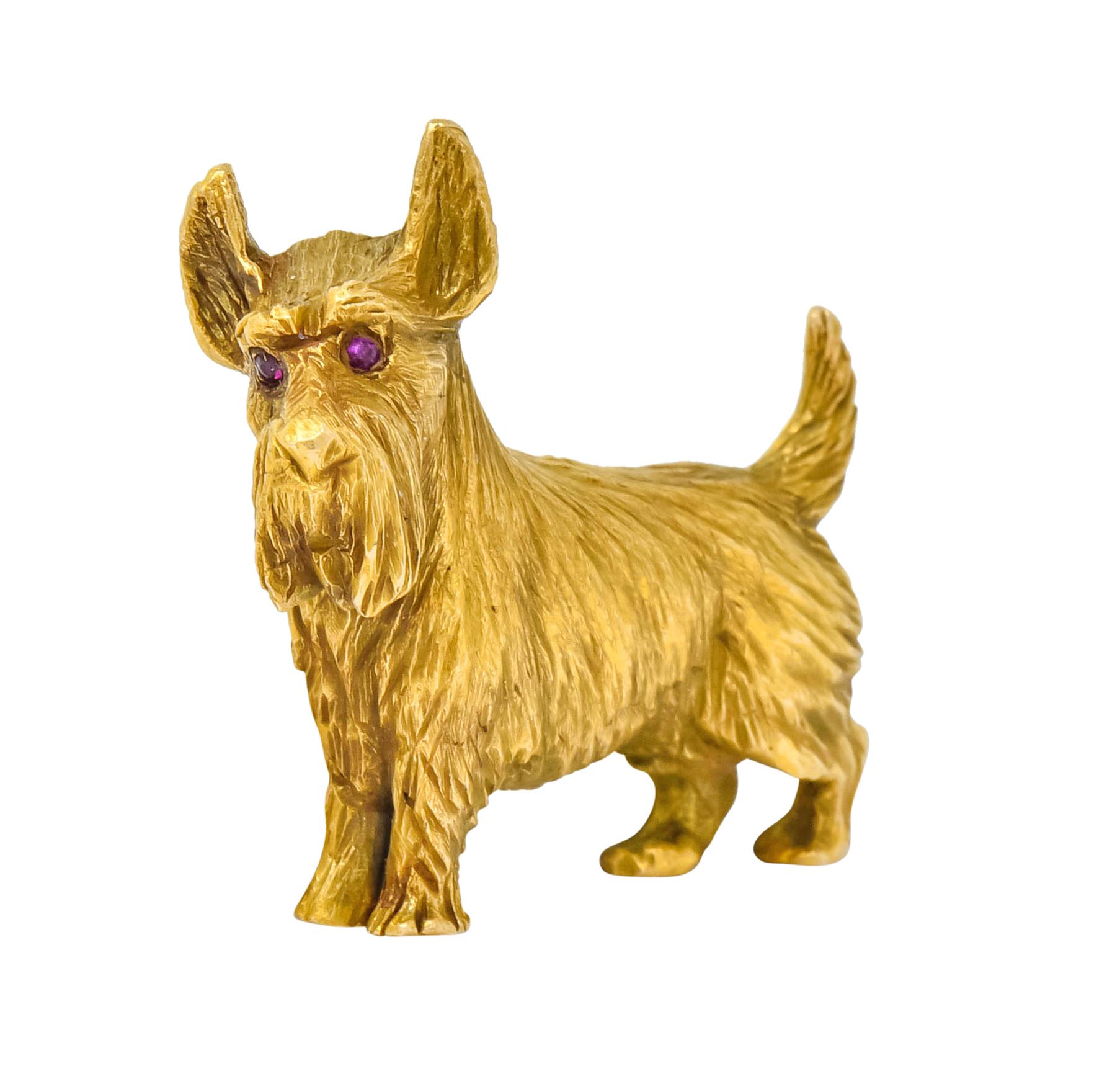 Designed as a sweet Scottie dog

With highly detailed textured gold fur

Accented with a rich ruby eye

Stamped 14K with serial number

Measuring: 1 1/2 Inch

Circa 1940

Total Weight: 16.4 Grams

Adorable. Friendly. Lovable. 
 

Stock Number: We-