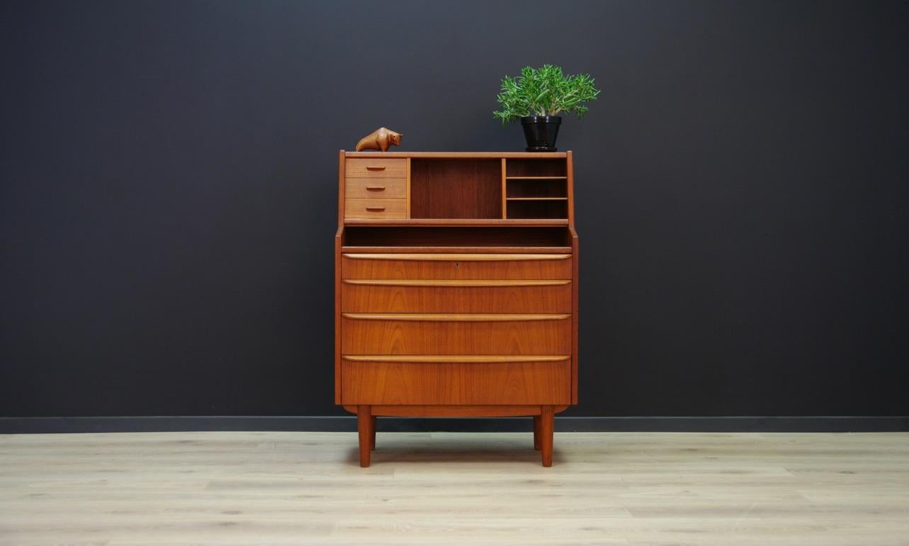 Fantastic secretary from the 1960s-1970s, Minimalist form - Danish design. The surface veneered with teak. Three drawers in the upper part of the furniture and four capacious drawers in the bottom. The furniture has a retractable top. Handles made