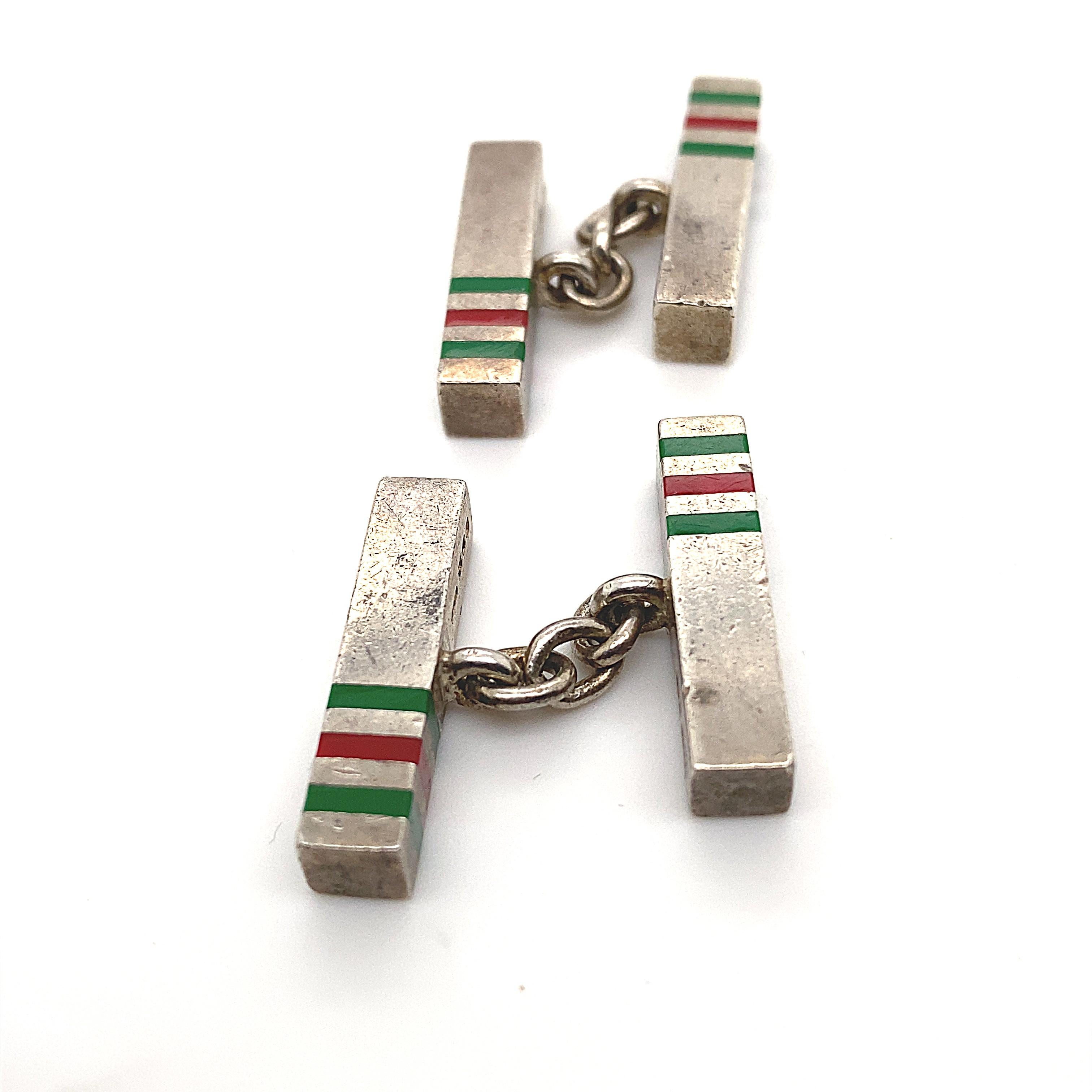 A retro pair of silver and enamel Gucci cuff links, circa 1990.

These classic vintage cuff links are designed as a matching pair of rectangular batons each featuring Gucci's iconic red and green stripes.

In 1964, Gucci introduced a version of its