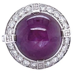 Retro Star 16 Carat Ruby Cabochon Diamond Platinum Halo Ring