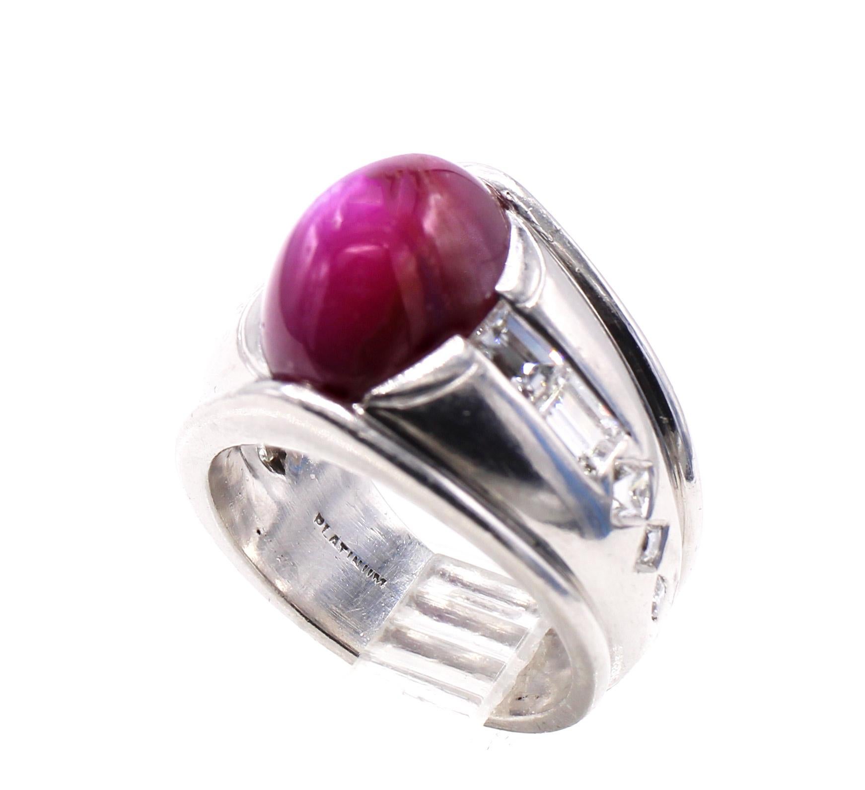 Beautifully hand made platinum band from ca 1940 featuring an oval cabochon star ruby measured to weigh approximately 8.5 carats. The dome shaped ruby displays a wonderful 6 legged star when light hits the surface. Set in a heavy bezel of platinum