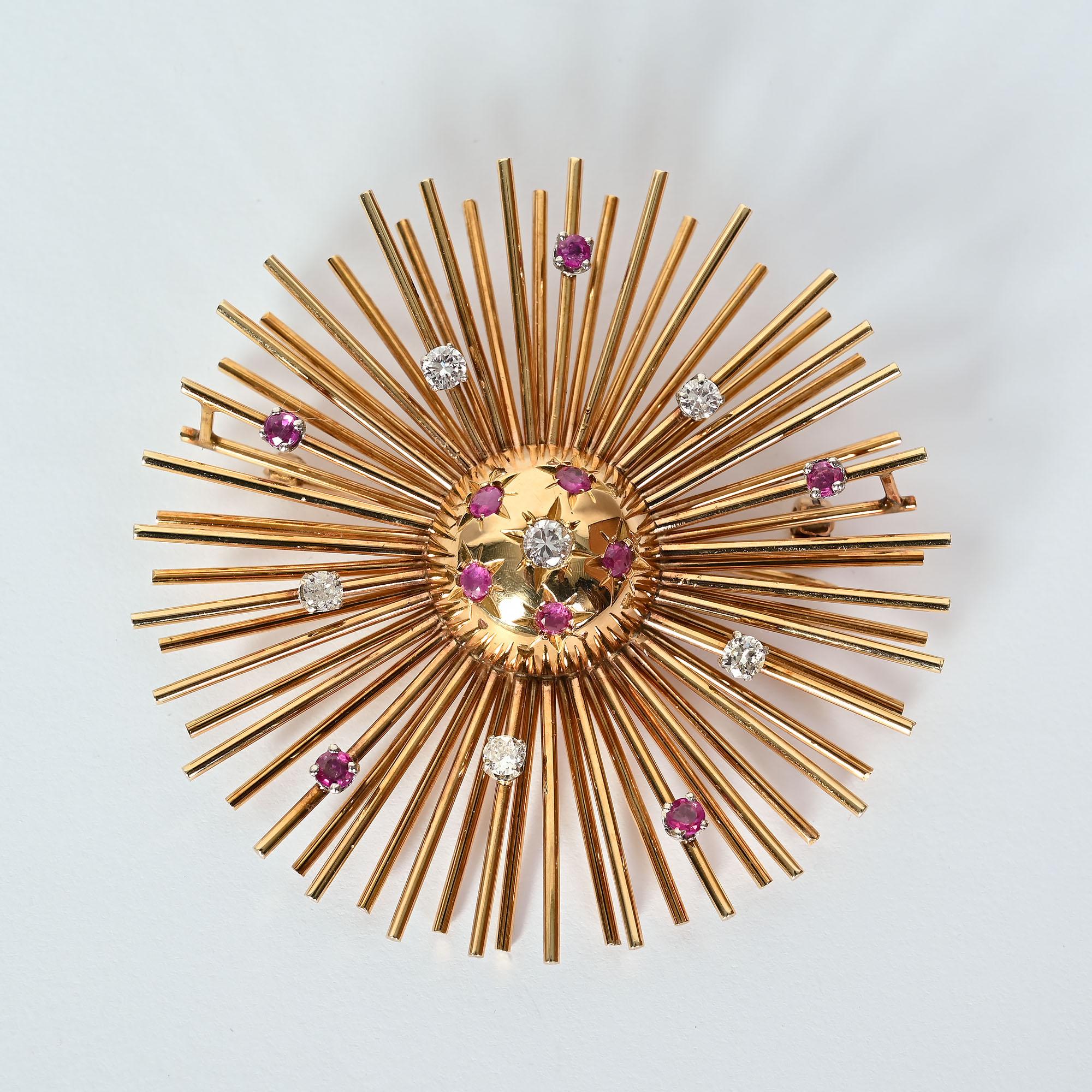Wonderfully Retro Sunburst brooch in 14 karat rose gold. The brooch has five round brilliant cut diamonds with a total weight of approximately .84 carats; G color. Ten round rubies weigh approximately 19.65 dwt. The center is domed giving nice