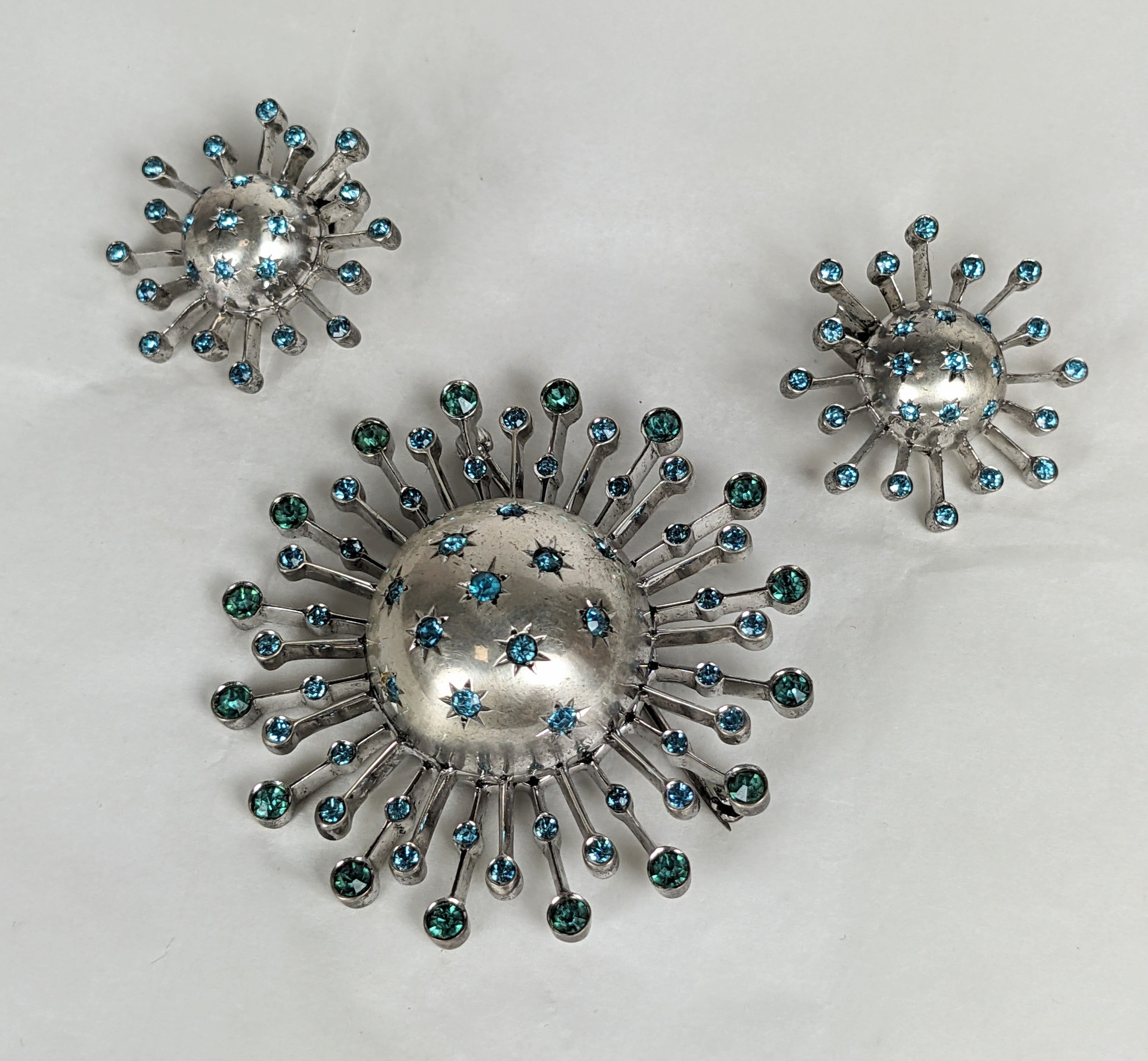 Lovely Retro Sterling Aqua Paste Starburst Set from the 1940's. Dimensional set likely by Reja but unsigned. Heavy quality construction with clip back fittings. Marked Sterling. 1940's USA. Brooch 2.5
