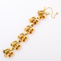 Bracciale retrò in argento e oro lavato con sculture geometriche a forma di rotolo