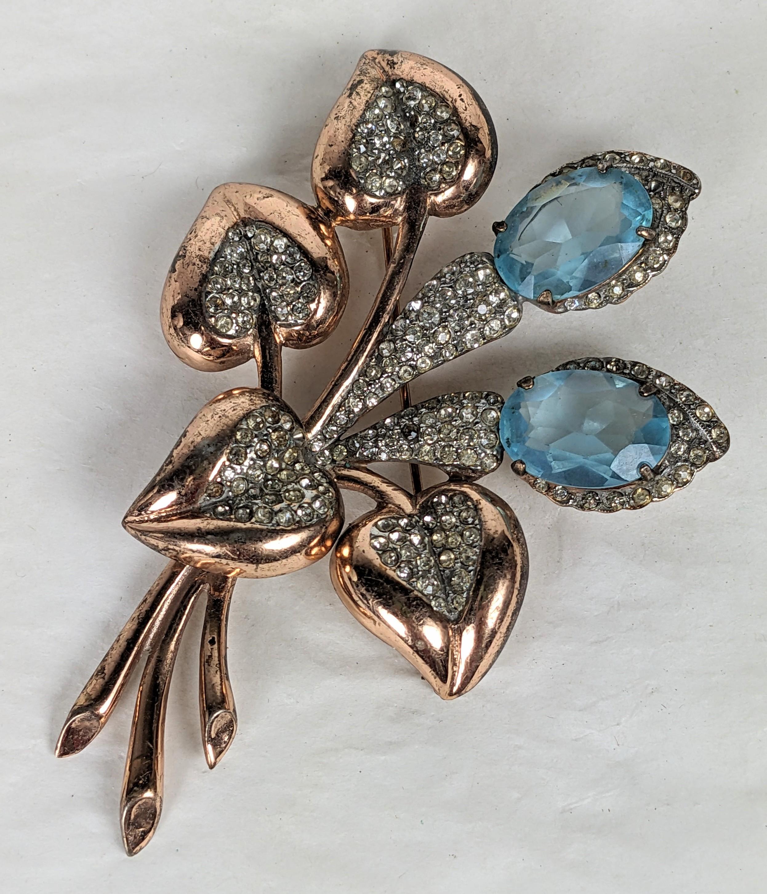 Striking Retro Sterling Vermeil Aquamarine Spray from the 1940's. Large scaled floral brooch in sterling with rose gold wash, pave accents and oval faux aquamarines. Unsigned. 3.75
