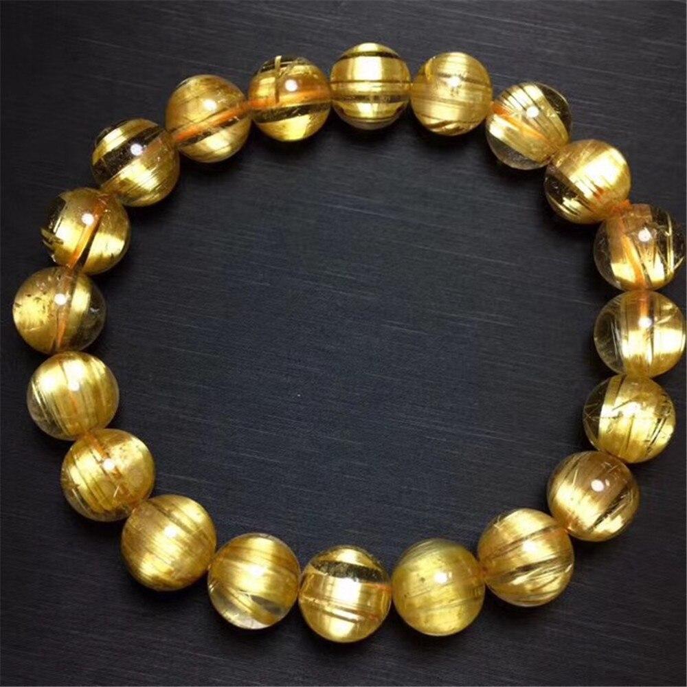 
Retro Style Gold Rutilated Titanium Quartz Bracelet . Set in 18 Karat Yellow Gold 

Rutilated quartz is a type of quartz with interior needle-like structures. The quartz is most often clear, but a rarer brown, smoky rutilated quartz is also