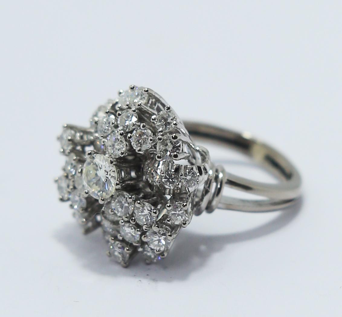 Retro Style Platinum Diamond ring with central diamond of 0.50ct colour H and VS clarity
With 22 diamonds of .10ct total 2.2ct and 3 side leafs with 3 diamonds each of 0.03 
Ring size Europe 53 US 6,5
But can be resize