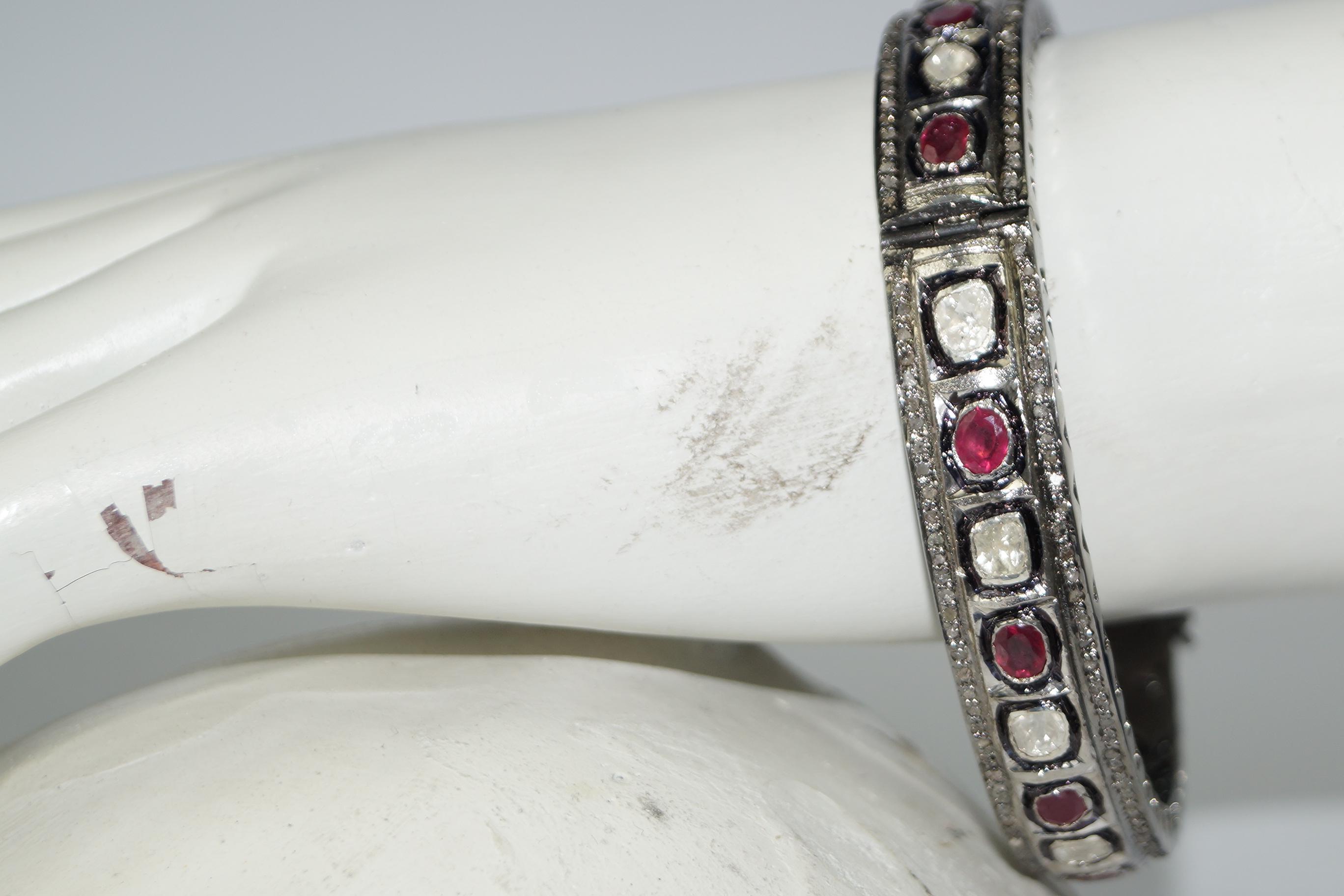 This beautiful retro style diamond oxidized silver ruby bracelet consists of :

Diamond - Rose cut and uncut diamond
Diamond origin- Natural
Diamond weight- 3.88cts

Metal- Silver
Metal purity- 925 (Sterling silver)
Metal color- Oxidized