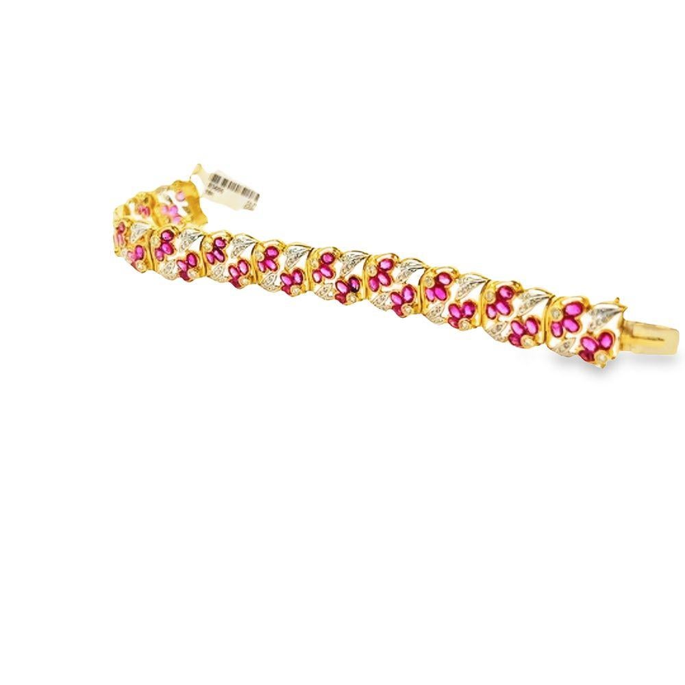 This Retro-style Ruby and white Diamond Yellow Gold Link Bracelet is a true jewelry masterpiece.  The 18 karat yellow gold link bracelet has a  combination of radiant rubies and sparkling white diamonds. This classic piece features 72 oval rubies