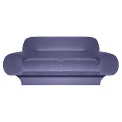 Canapé de style rétro avec bras courbés surdimensionnés