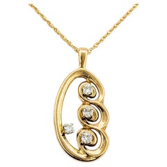 Retro Swirl Diamond Pendant in 14k Yellow Gold Retro Swirl Diamond Pendant in 14k Yellow Gold