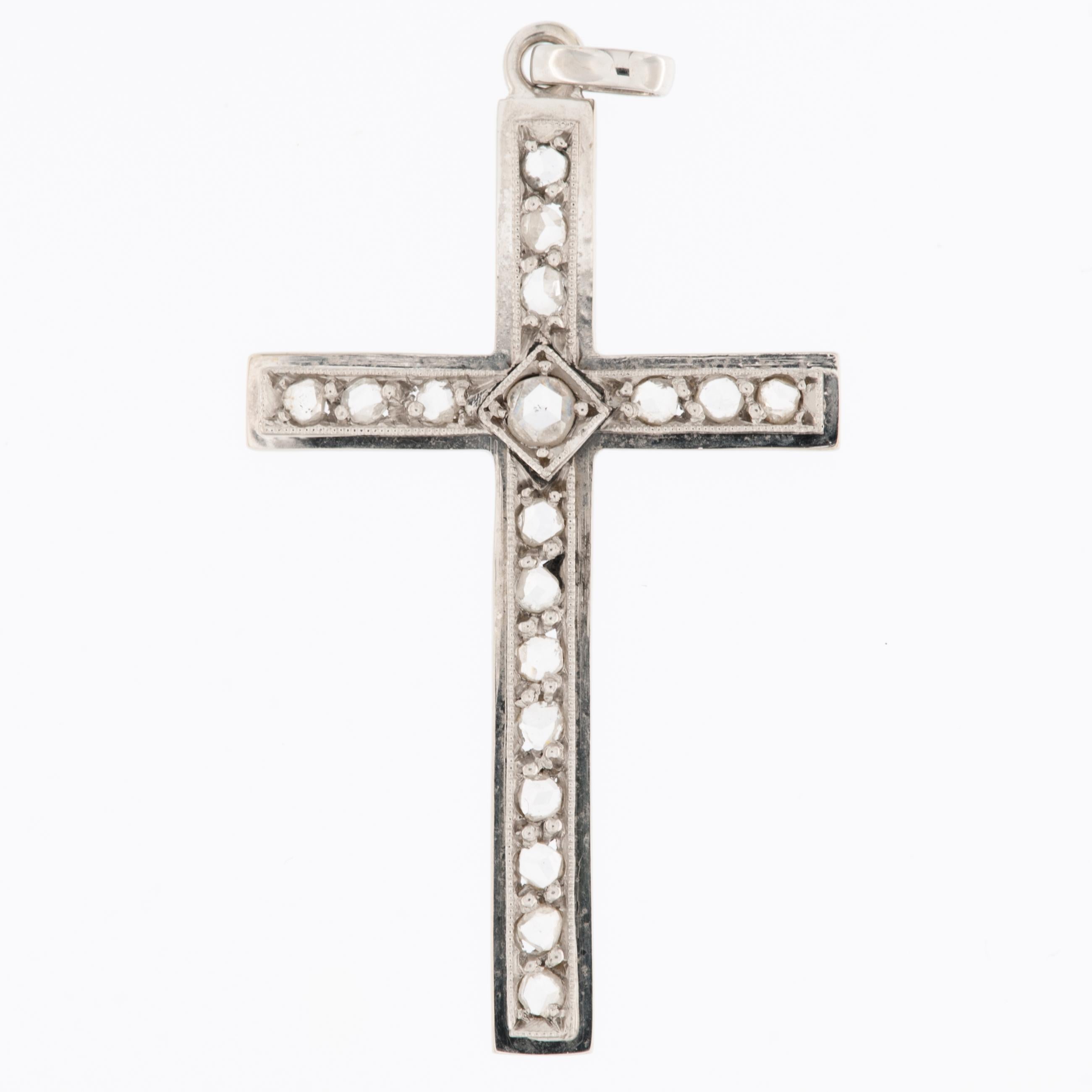 The Retro Swiss 18kt White Gold Cross with Diamonds featuring old-cut diamonds is a piece of jewelry that combines vintage design elements with the timeless beauty of diamonds.

The cross is crafted from 18kt white gold, which is known for its