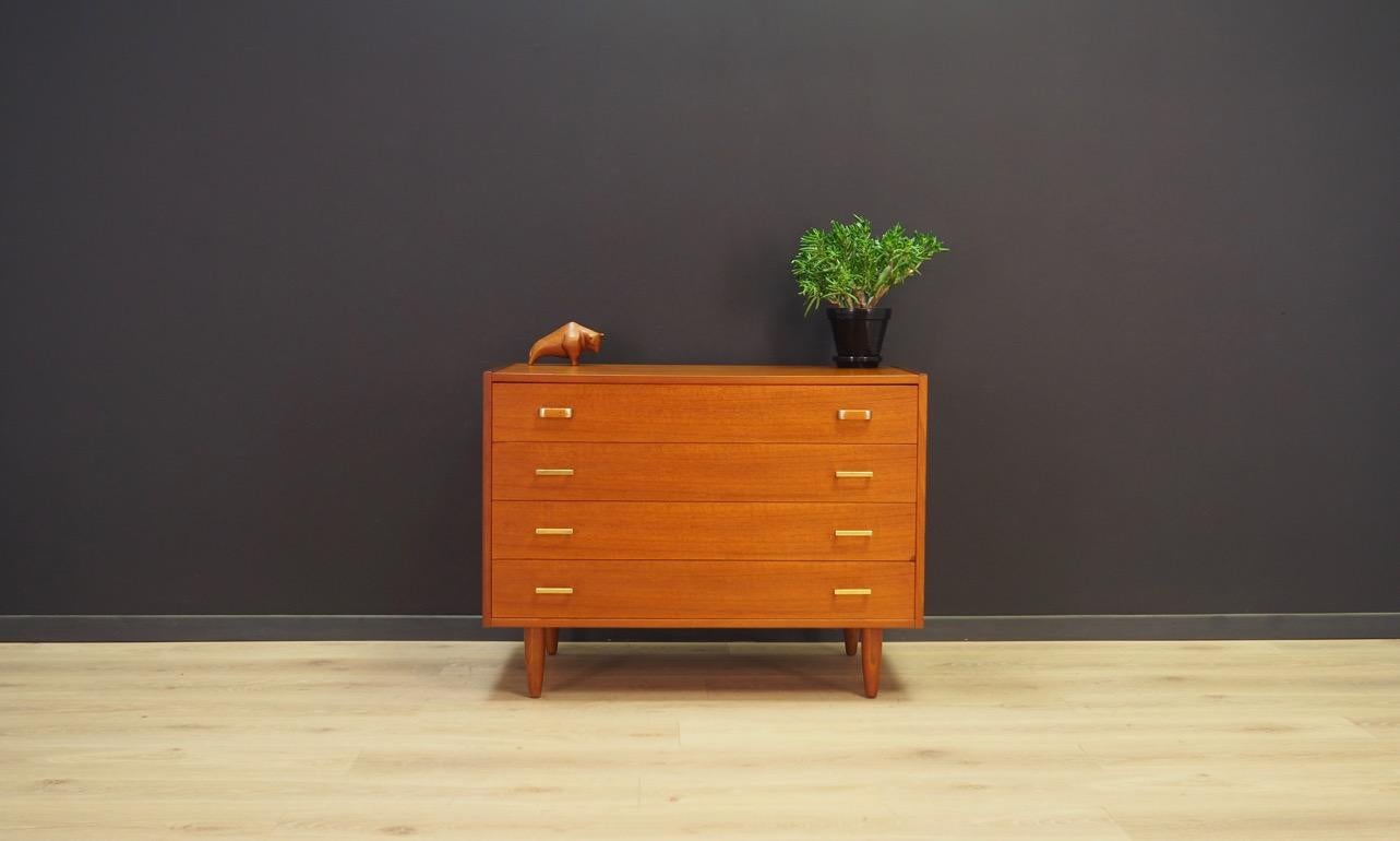 Retro chest of drawers from the 1960s-1970s, Danish design. Surface veneered with a teak, has four capacious drawers. Preserved in good condition (minor scratches, filled veneer loss), directly for use.

Dimensions: Height 66 cm, width 88.5 cm,