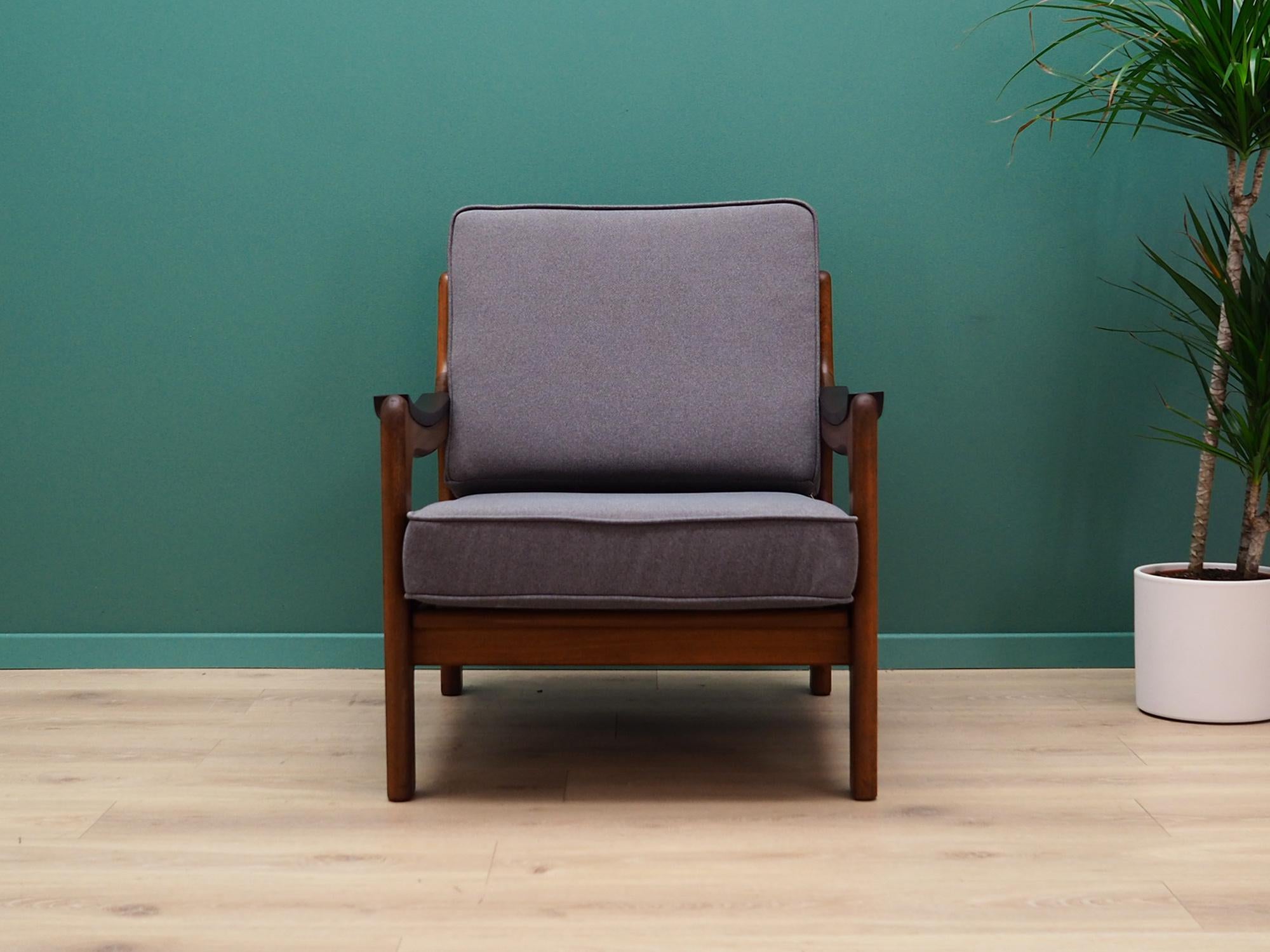 Superb armchair from the 1960s-1970s. Scandinavian design, Minimalist form. New upholstery made of grey fabric, construction made of solid teak wood. Preserved in good condition (small bruises and scratches on wood), directly for use.

Dimensions: