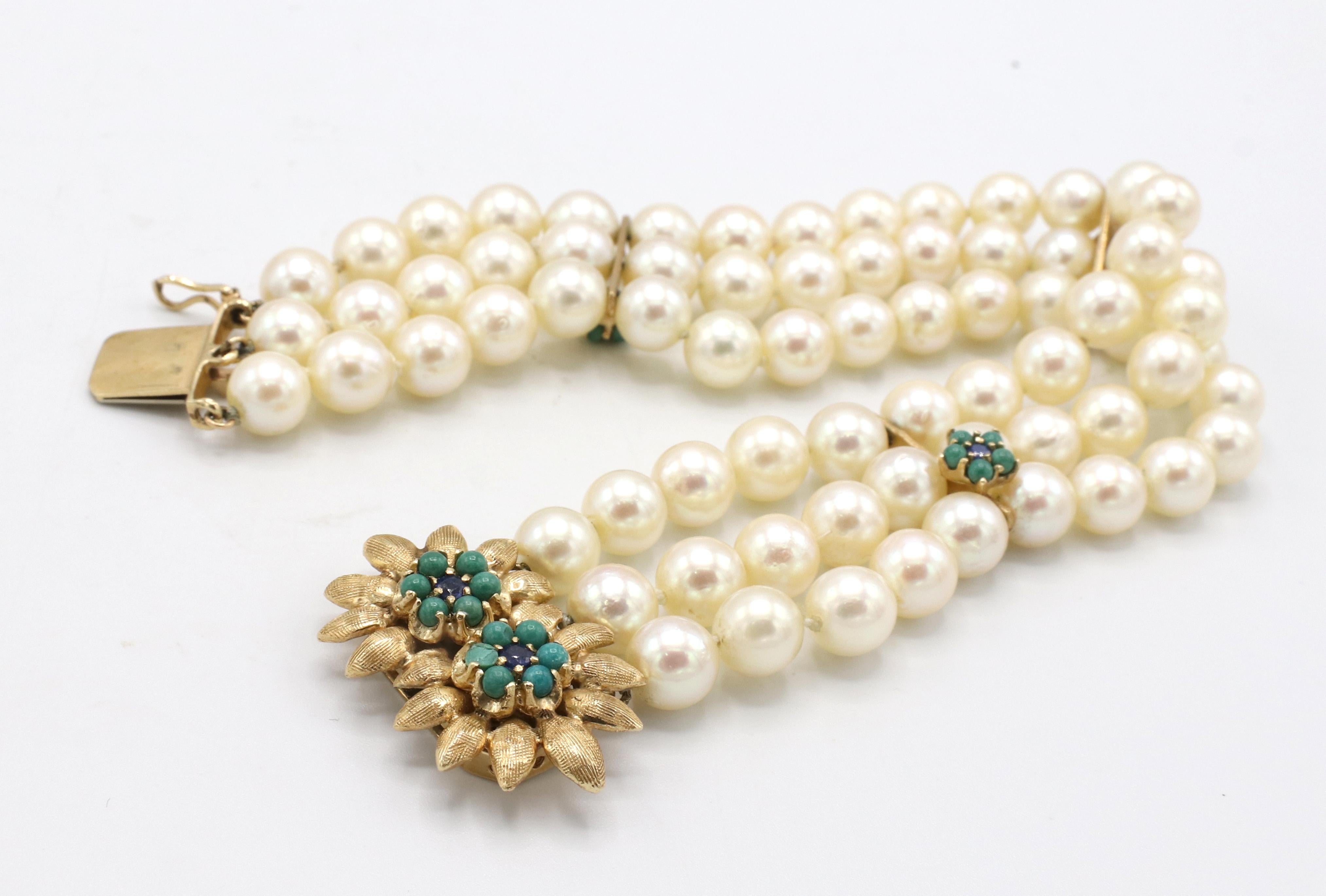 Retro Three Row Multi Strand Pearl Bracelet With 14 Karat Gold, Turquoise and Blue Sapphire Clasp 
Metal: 14k yellow gold
Weight: 40.6 grams
Length: 7.25 inches
Width: 0.75 inches 
Gemstones: Turquoise (2 stones chipped) and blue sapphires


