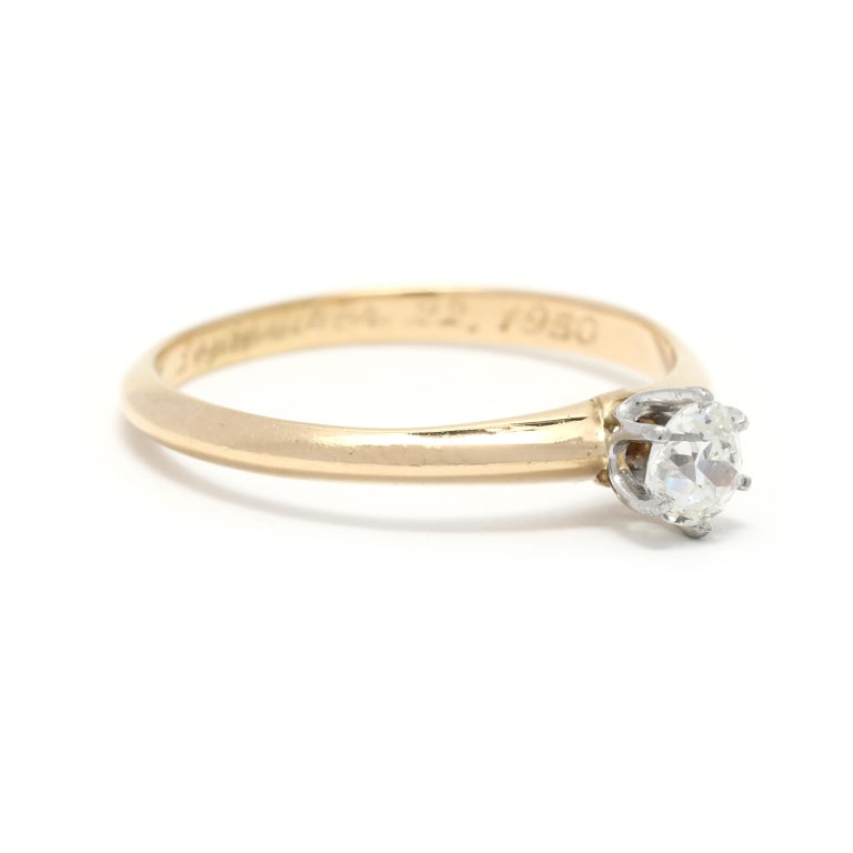 This stunning 0.35ctw retro Tiffany and Co. diamond solitaire engagement ring is the perfect way to make a statement. Crafted in a timeless combination of platinum and 18K yellow gold, the vintage diamond engagement ring is sure to bring a touch of