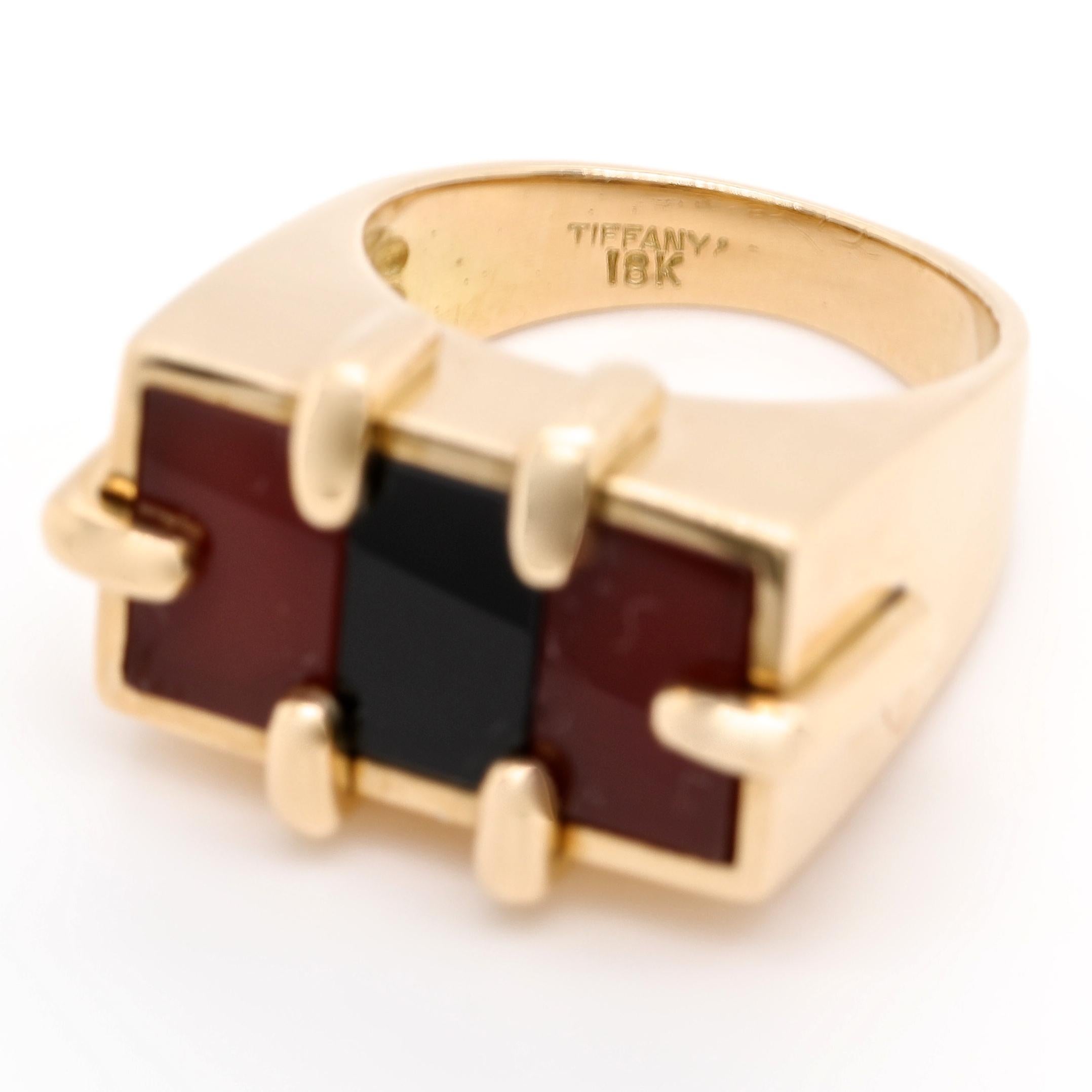 Substantial yellow gold statement rings are a very desirable and popular look right now. Get the look that everyone is on the hunt for. This is a Retro Tiffany & Co. Carnelian Onyx 18k Gold Ring. Signed Tiffany, 18k. Circa 1960's. 

Flawless