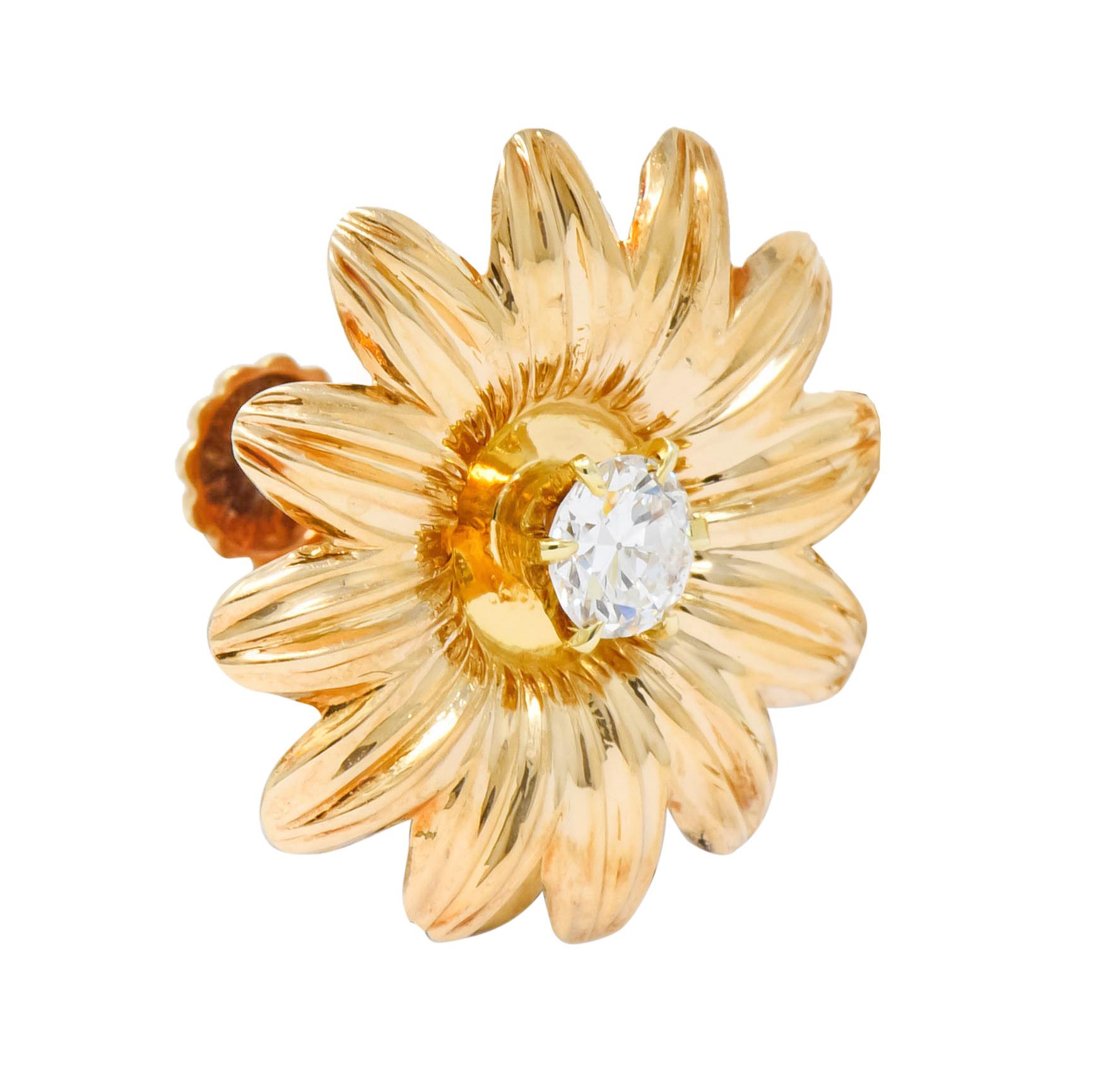Each earring designed as a fully bloomed flower with realistically ridged petals and a high polished finish

Centering prong set transitional cut diamonds weighing approximately 0.52 carat total, G/H color and VS clarity

Completed by screw