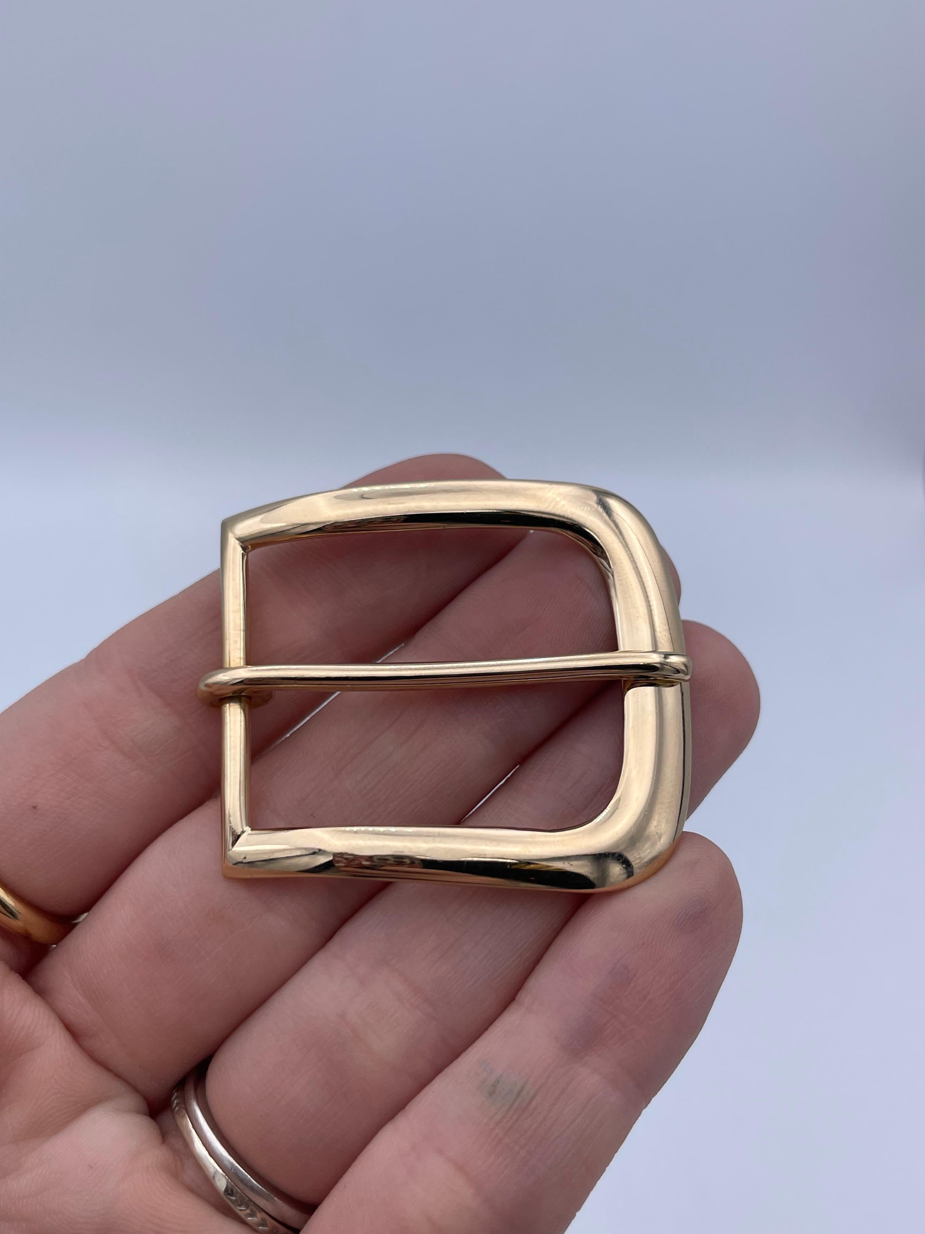 Gold belt buckle.  Made, signed and numbered by TIFFANY & CO.  Extra heavy gauge 14K yellow gold.  1 5/8