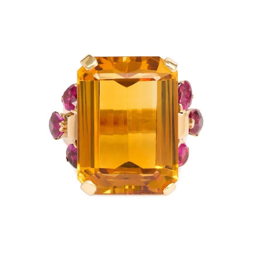 A Retro citrine cocktail ring flanked by pear-shaped rubies, in 14k gold. Tiffany & Co.  Citrine measures approximately 21.5mm x 16mm