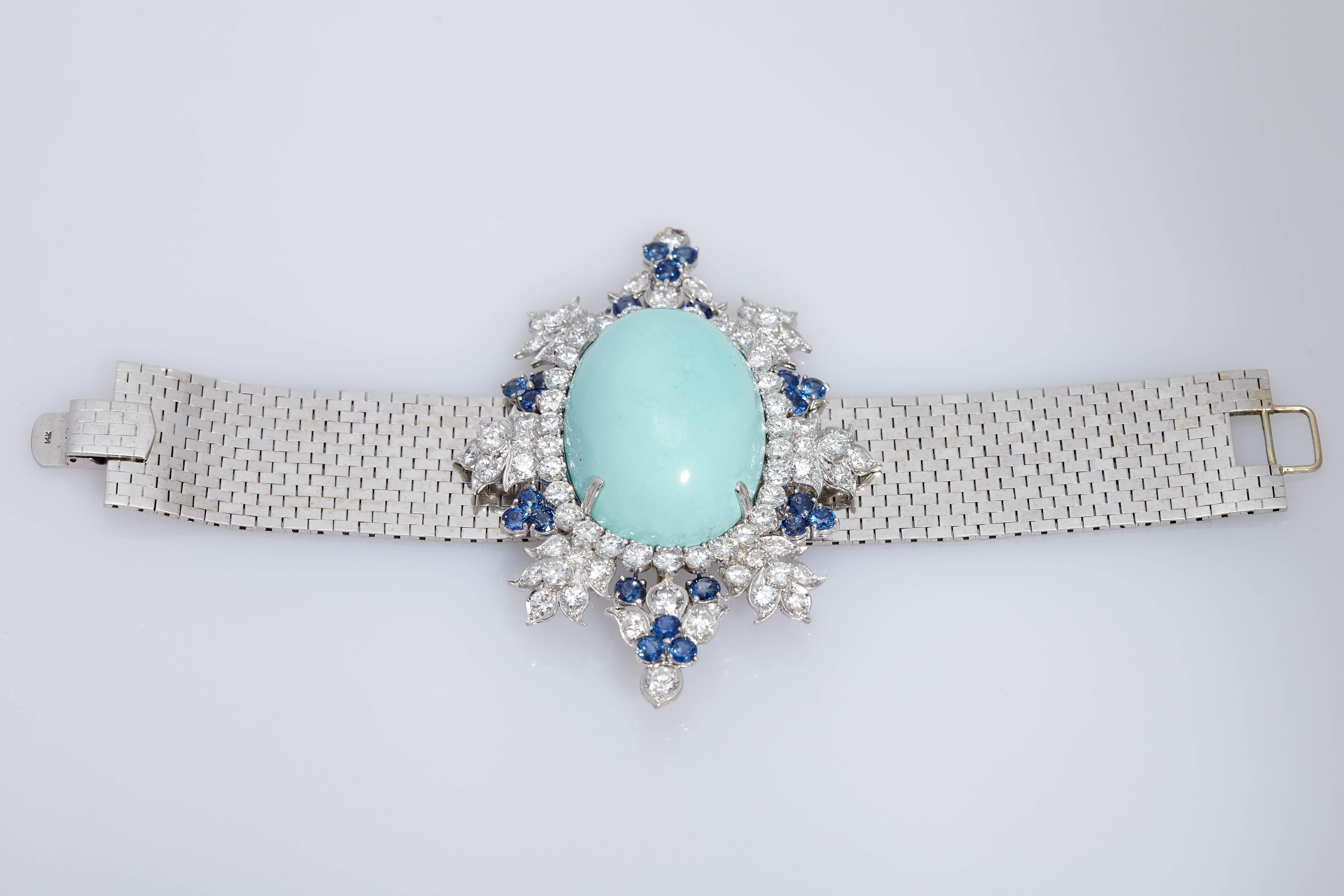 An beautiful bracelet in platinum and 14kt white gold with turquoise, sapphires and diamonds (circa 20 carats). The centre-piece is detachable to be worn as a brooch.  Made in the United States, circa 1950s.