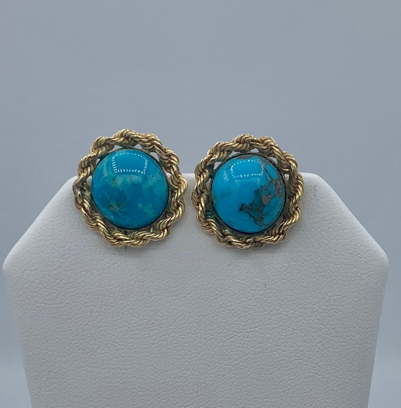 This is a gorgeous pair of Antique Retro Turquoise earrings in 14 Karat Yellow Gold.  The wonderful round Turquoise cabochons are exquisite with stunning bright blue color and beautiful matrix that I just love.  The cabochons are set in classic