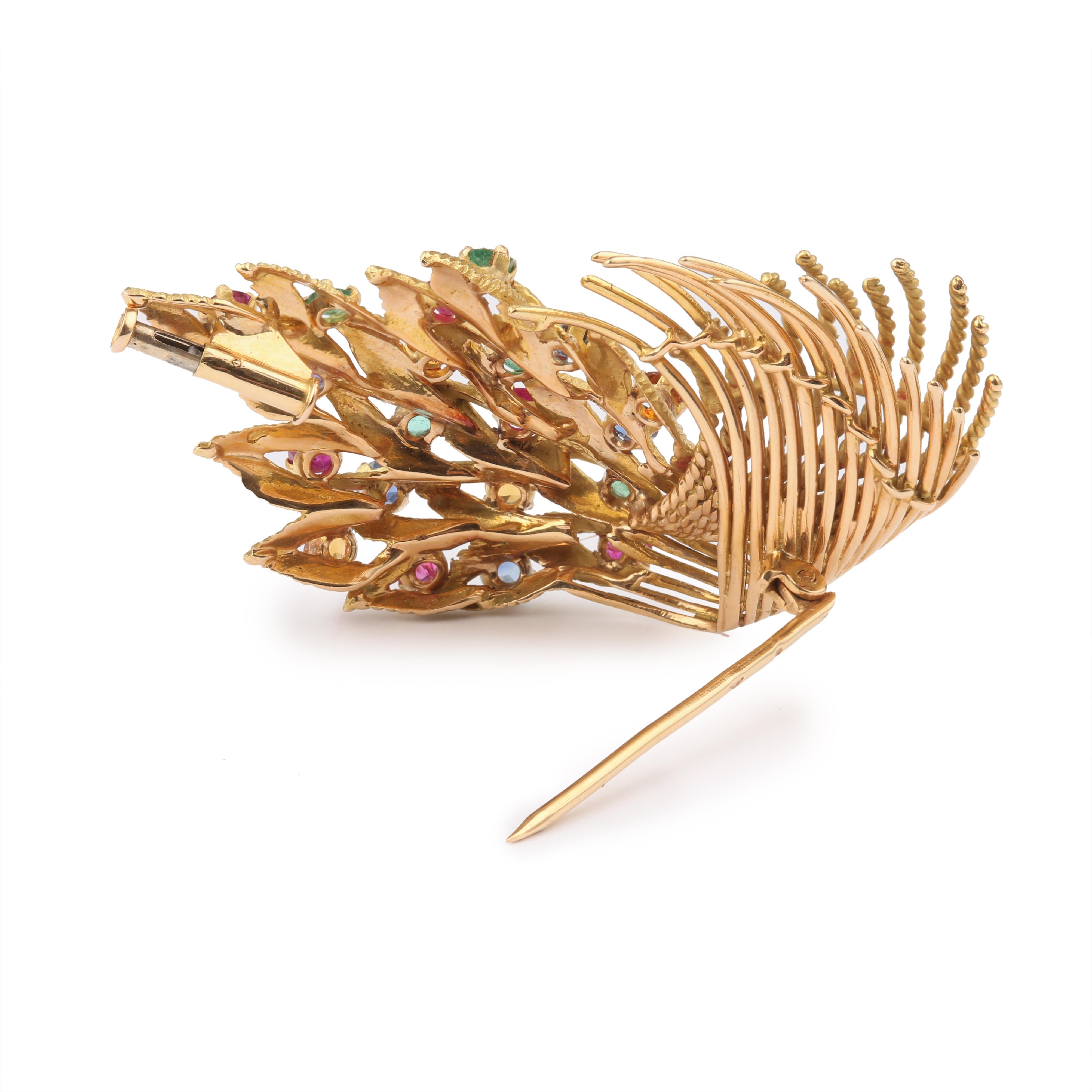 Retro brooch featuring a leaf in yellow gold and set with sapphires, rubies, emeralds and citrines.

Total estimated weight of sapphires : 0.60 carat

Total estimated weight of rubies : 0.60 carat

Total estimated weight of emeralds : 0.40