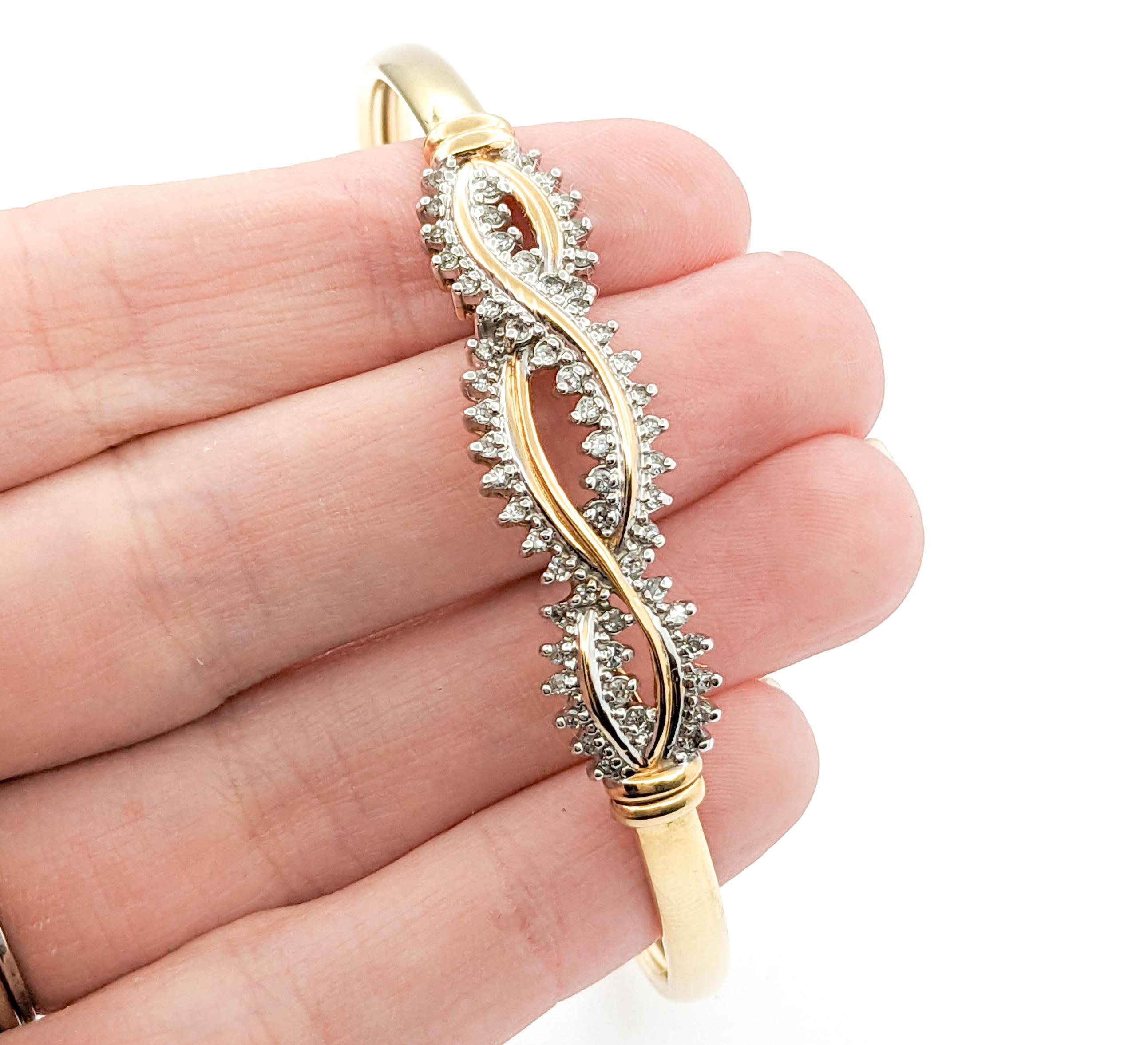 Retro Twist Diamond Bangle Bracelet in Yellow Gold

Introducing our elegant diamond fashion bracelet in luxurious 14k yellow gold. This stunning cocktail twist bracelet features .50 carats of round, near-colorless I-clarity diamonds, adding a touch