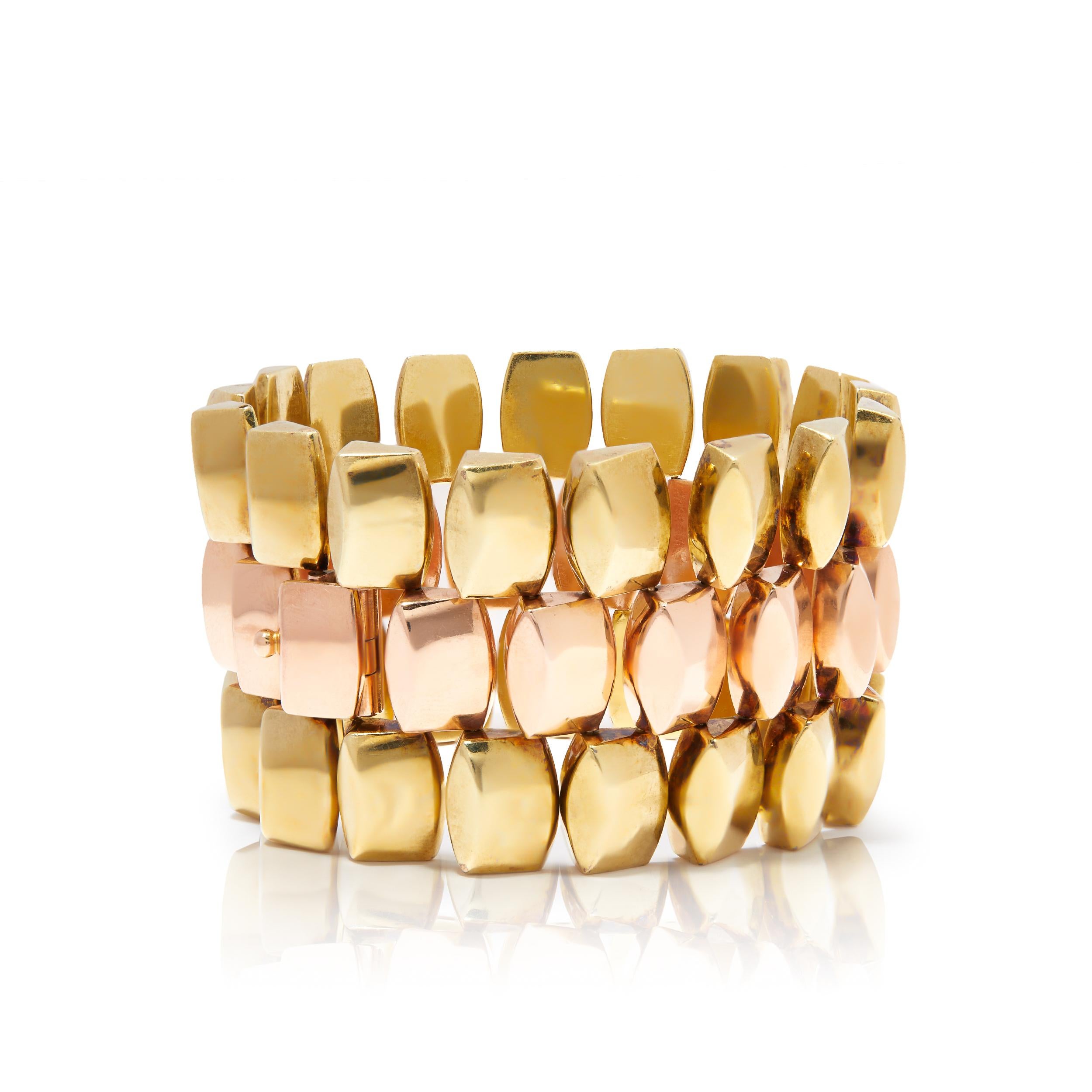 Get ready for Retro galore with this fabulous geometric link bracelet from the era of cocktail jewellery! Sleekly sculpted in gleaming 14ct gold, the three rows are composed of multi-dimensional links interwoven in an ingenious geometric pattern.
