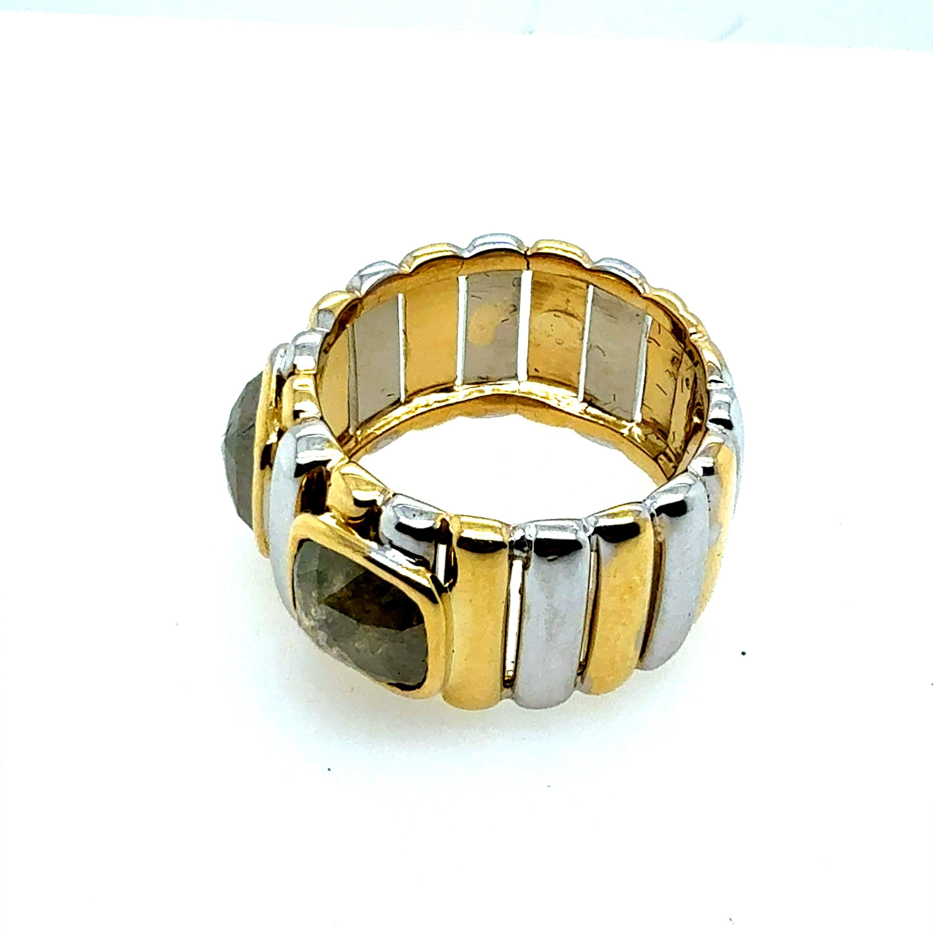 Retro two-tone white and yellow gold statement ring featuring natural rose cut diamonds totaling approximately 1.5 carats. The principal stones each measure about 6.3 mm in length and width. 
The ring measures 10.8 mm wide, is a size 6, and weighs