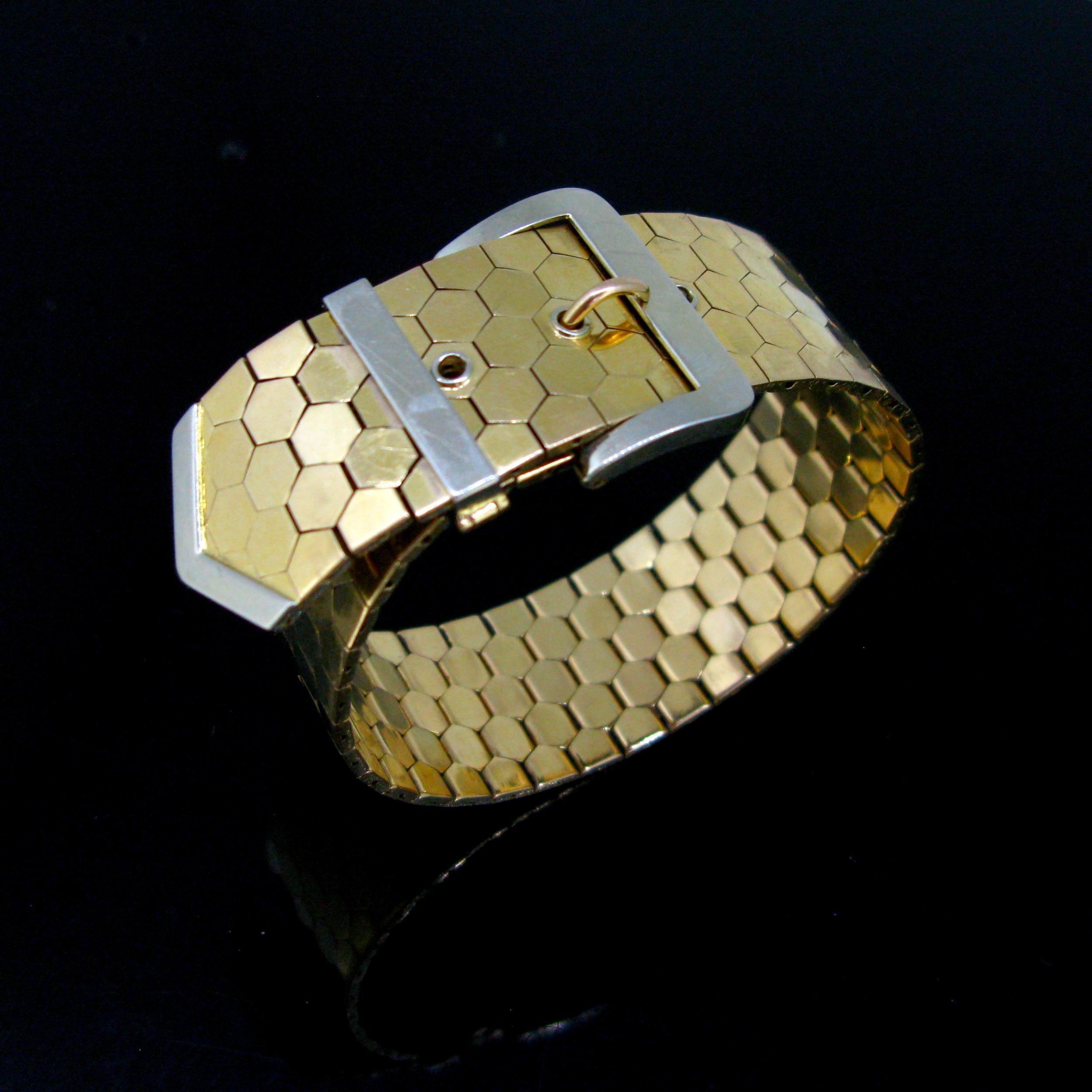 Weight:	79.5gr


Metal:	18kt yellow and white gold 
	

Condition:	Very Good


Hallmarks:	French, Mercury’s head 


Comments: 	This buckle/belt bracelet is made in 18kt yellow and white gold. 	This one is from the Retro period circa 1940. It has a