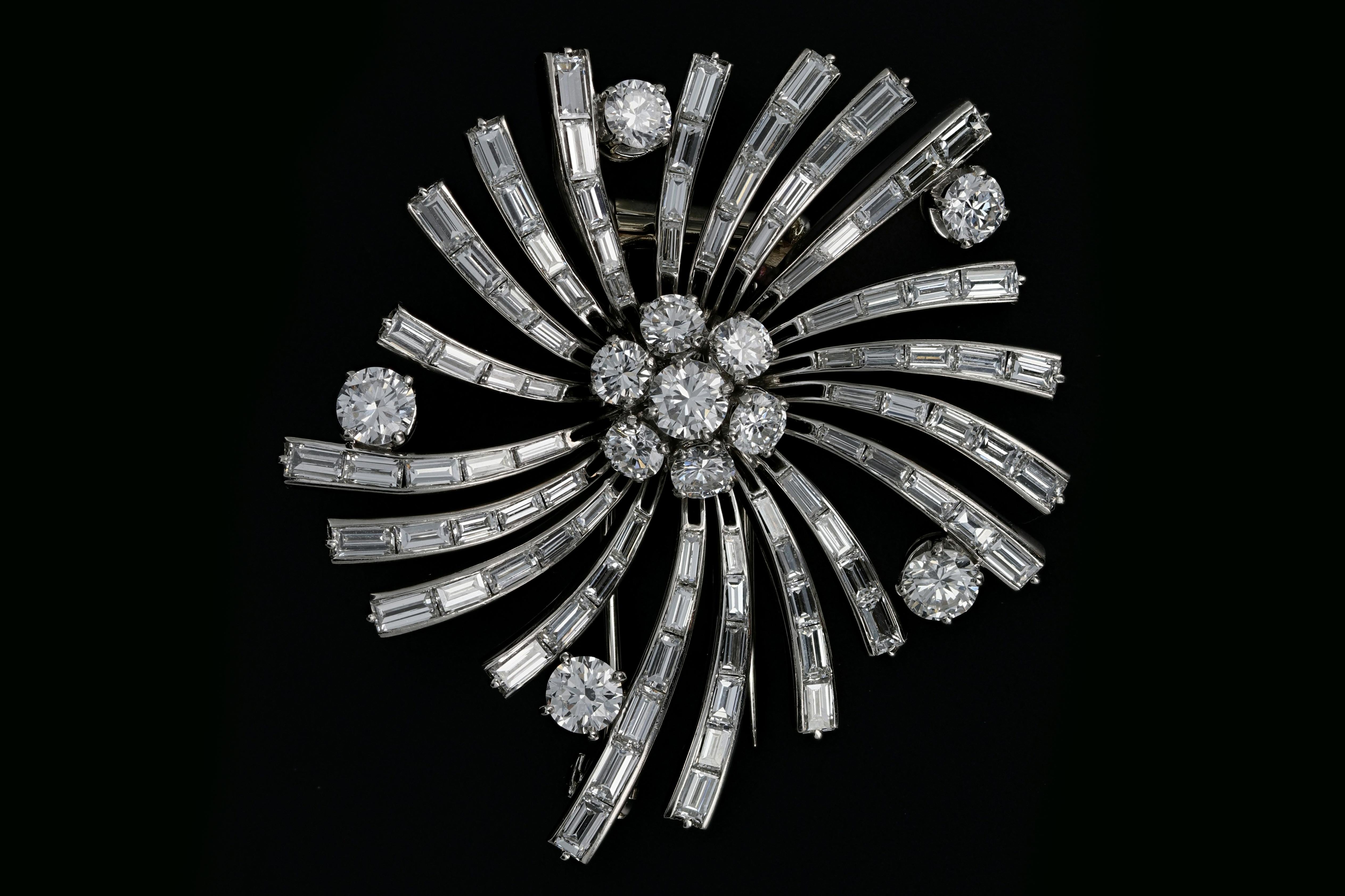 Era: Retro

Designer: Van Cleef & Arpels

Hallmarks: Van Cleef & Arpels , 3807. C5

Composition: Platinum

Primary Stone: Diamond (Rounds & Baguettes)

Stone Carat Weight: Approximately 10 Carats

Color/ Clarity: VVS2-VS1 / E-G

Brooch Measurement: