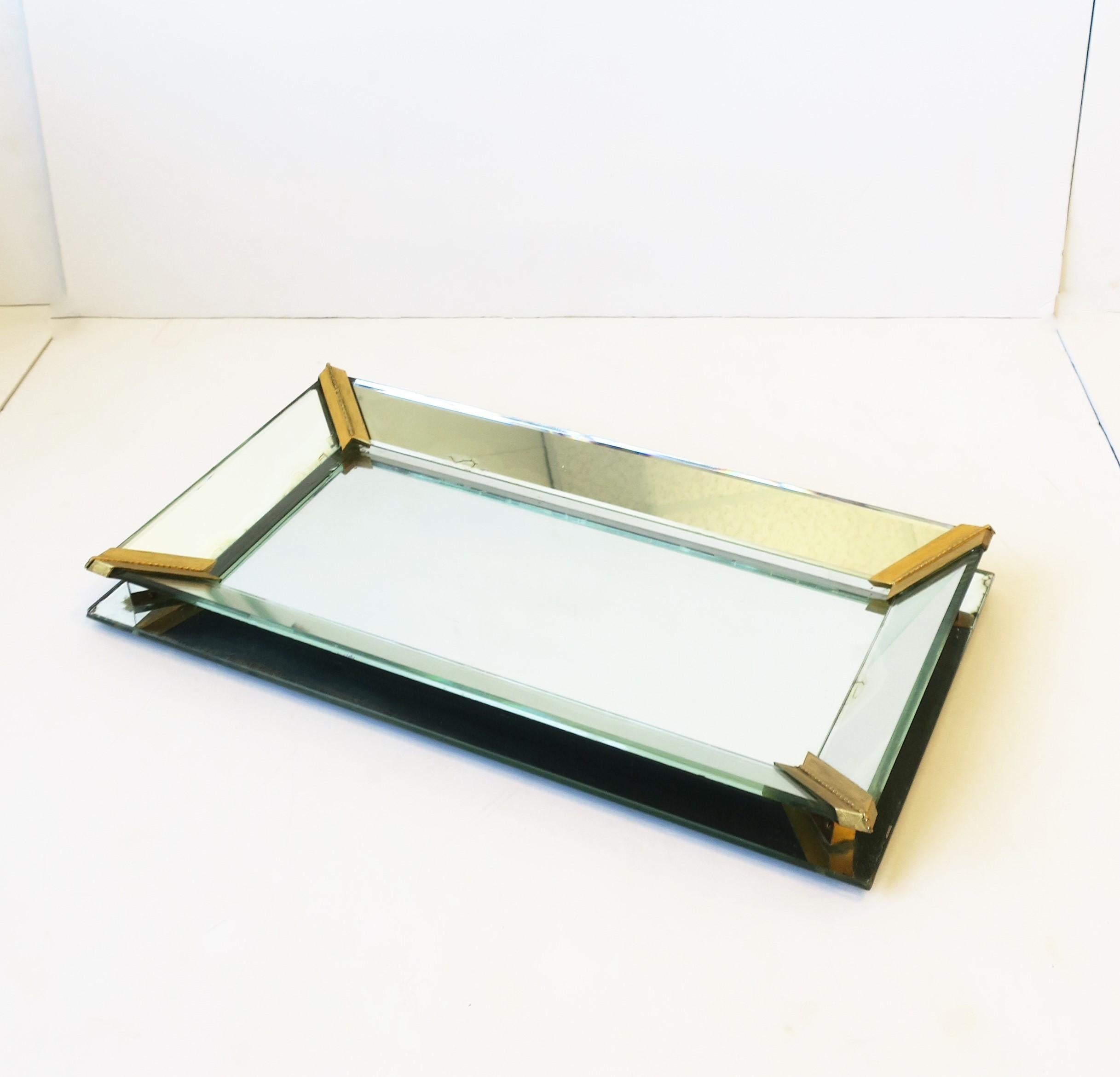 A retro vanity mirror tray, circa 1950s. Corners are gold gilt metal. A great piece to hold and display your favorite perfume, jewelry, hair clips, etc., in a bathroom, vanity area, walk-in-closet, etc. Dimensions: 2