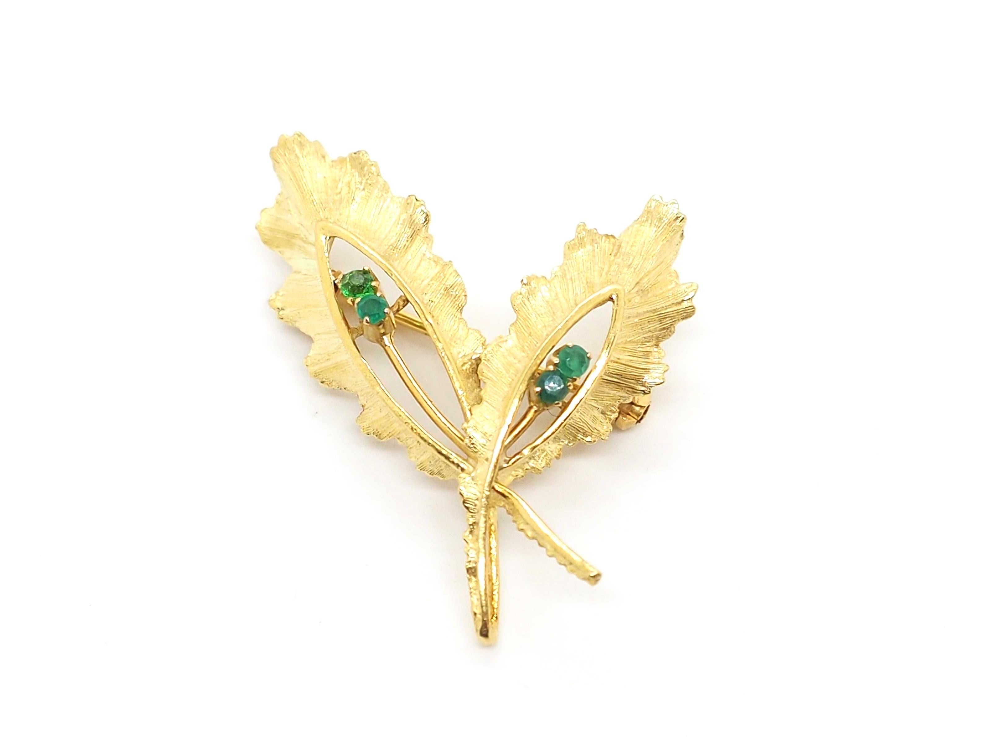 An elegant vintage brooch crafted in 18K yellow gold. It features 4 emeralds. The designs of this item was inspired by nature. And this theme was very popular during the 50s and 60s, when the brooch was created:

Total weight: 5.5