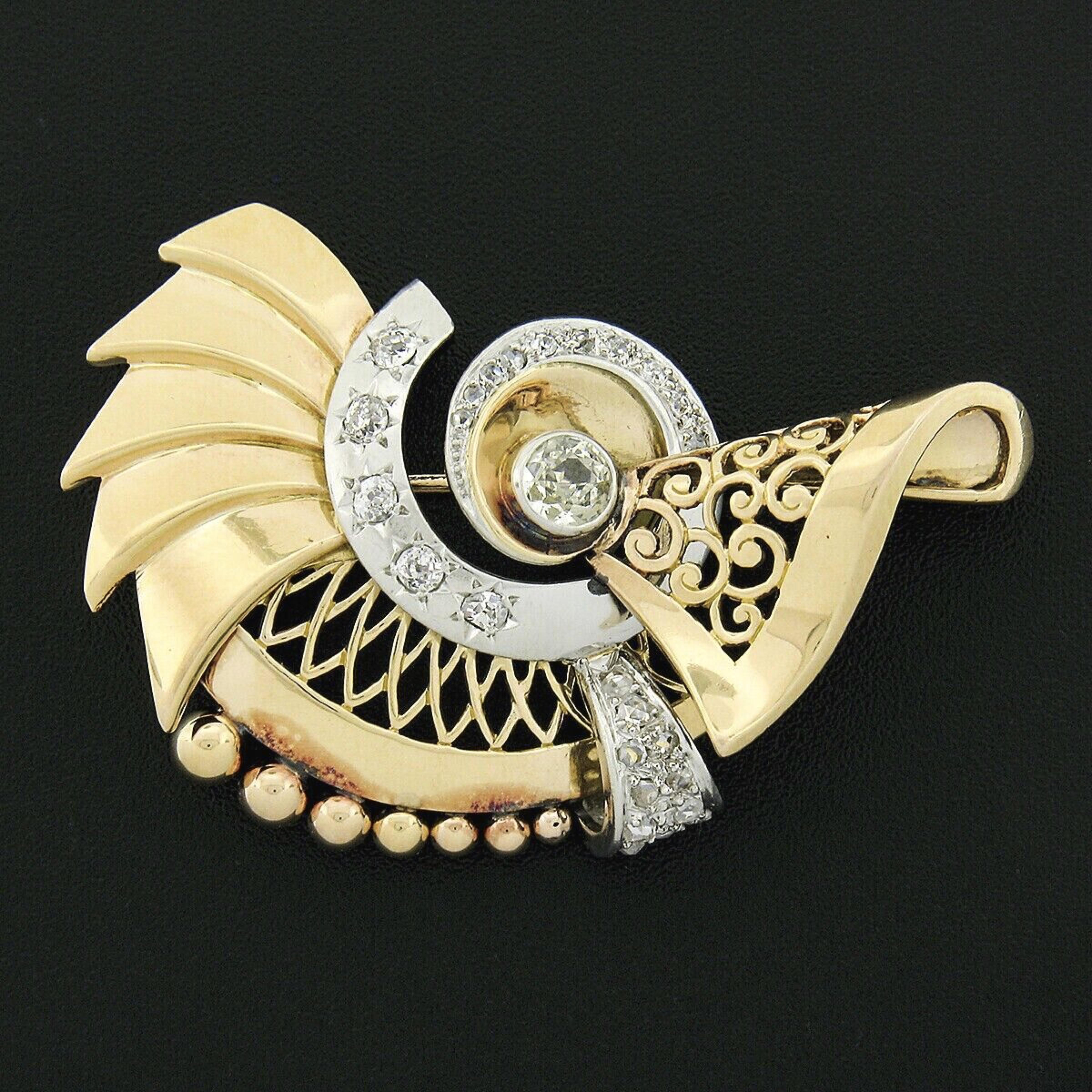 Here we have a gorgeous retro vintage European brooch that was crafted from solid 18k gold and platinum. It features an outstanding design set with a fine quality old European cut diamond neatly bezel set at the center of the swirl design, standing
