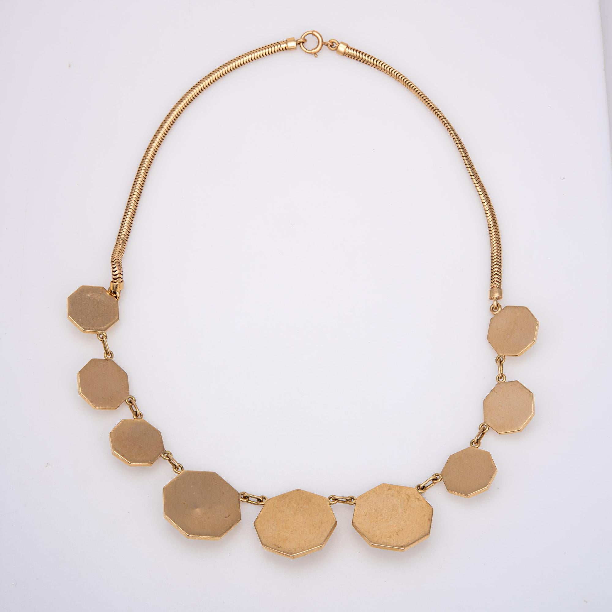 Finely detailed Retro vintage necklace crafted in 14 karat yellow gold (circa 1940s). 

A graduated display of octagonal charms adorns the necklace, with a raised and pointed faceting of the gold that allows for a beautiful subtle shimmer. Measuring