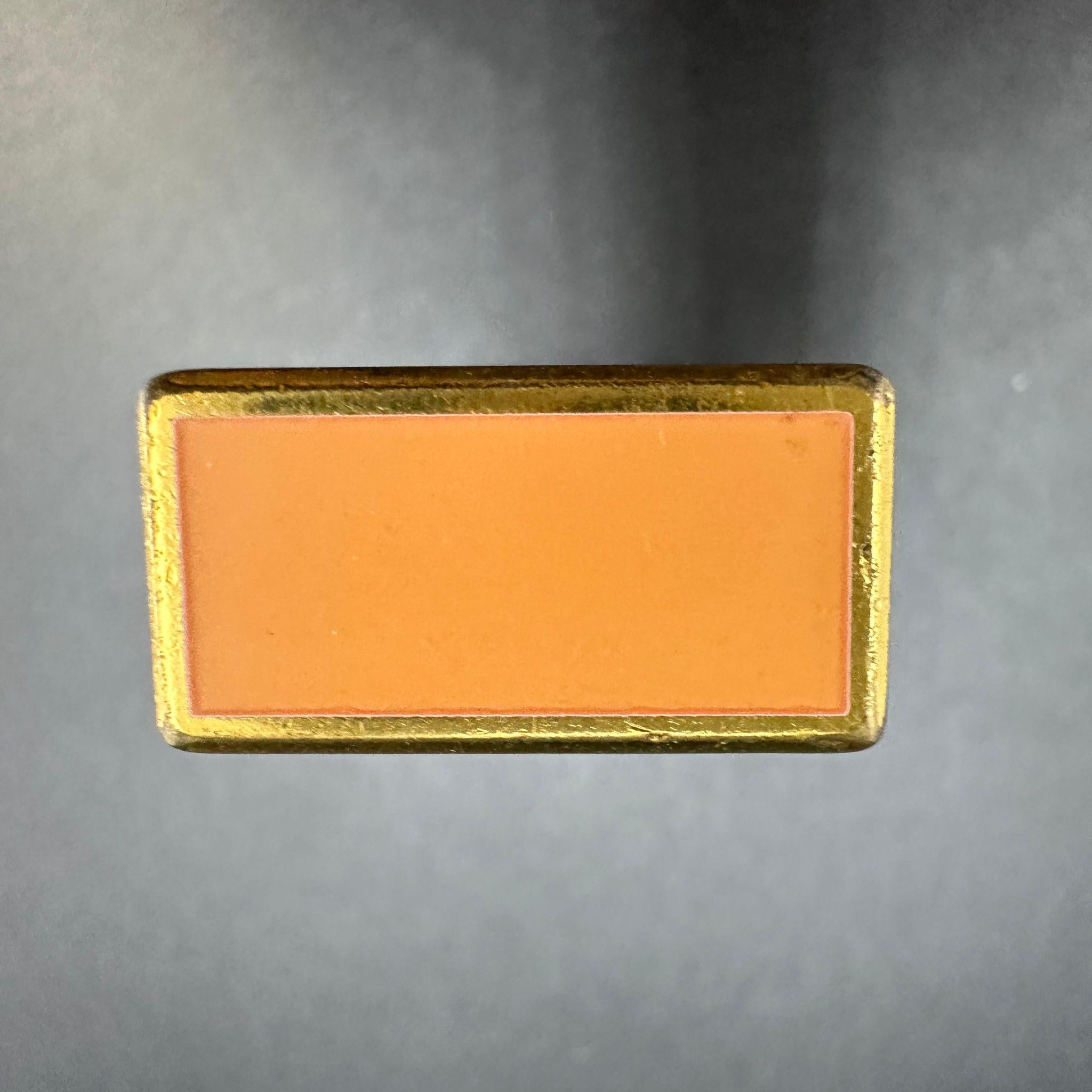 Vintage Vert Rare Circa 1980s Dunhill Orange Lacquer & Gold Plated Lighter
Retro style 
Comes with a Dunhill box and papers 
The lighter is in very good condition 
The lighter sparks, ignites and flames
The orange lacquer style is a very rare style