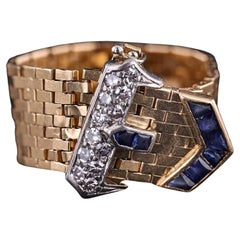 Retro Vintage Tiffany Belt
Buckle Ring of 14k Gold Sapphire and Diamond Retro Vintage Tiffany Belt
Buckle Ring of 14k Gold Sapphire and Diamond
