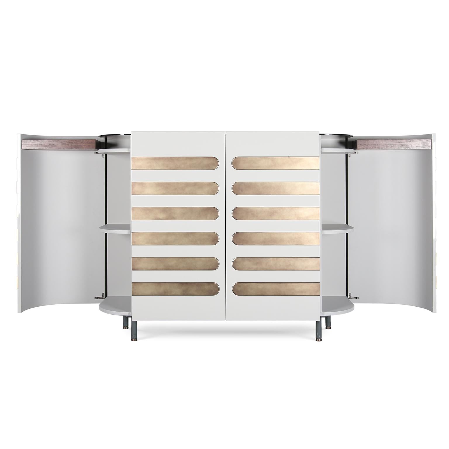 Retro Microphone-Inspired Dresser- a captivating blend of nostalgia and contemporary design. This exquisite piece is meticulously crafted, finished in a luxurious high gloss that exudes sophistication. The aged brass details add a touch of vintage
