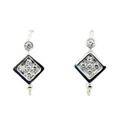 Retro White Gold 0.6 Carat Natural Colorless Diamond Earrings, Circa 1980