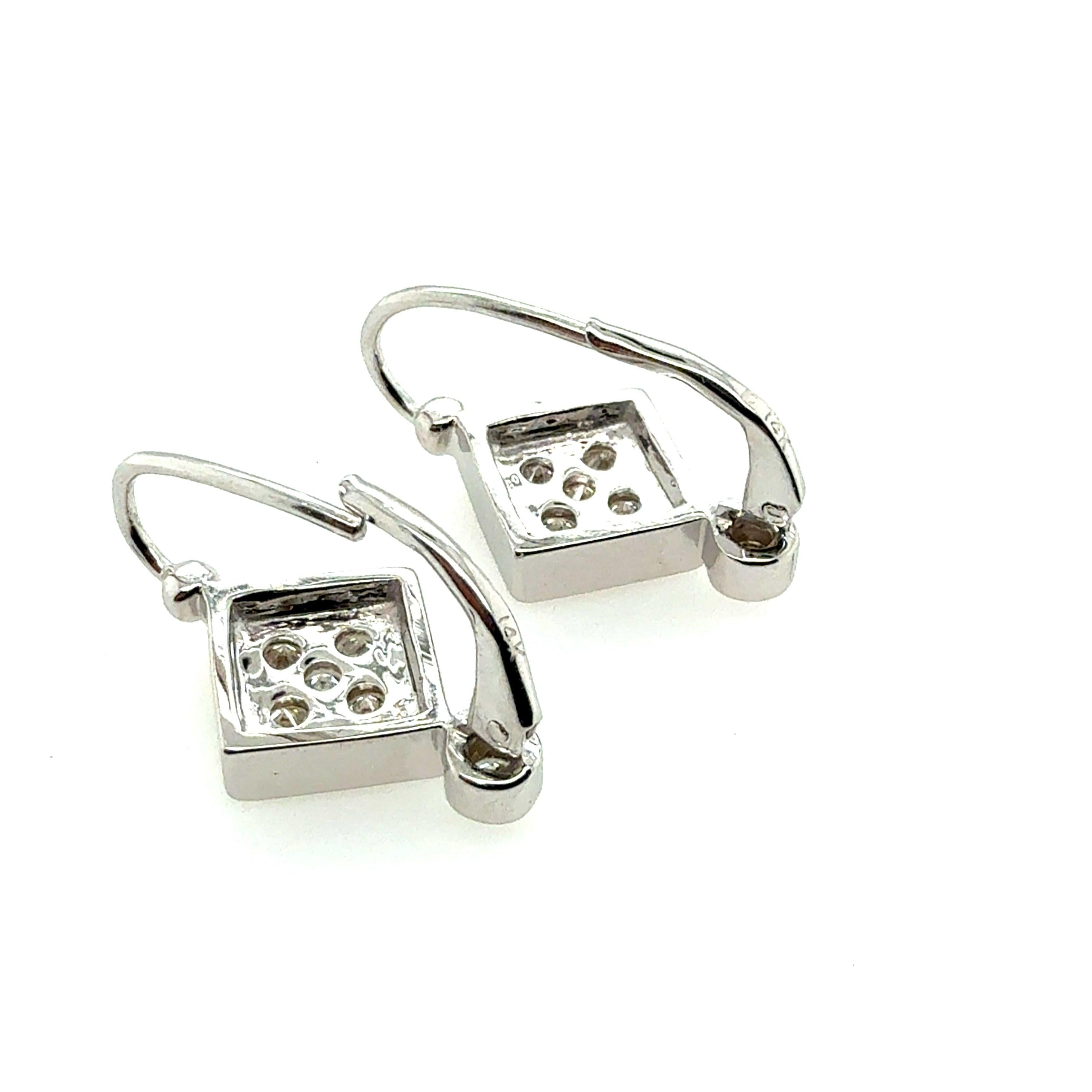 Retro White Gold 0.6 Carat Natural Colorless Diamond Earrings, Circa 1980 For Sale 1