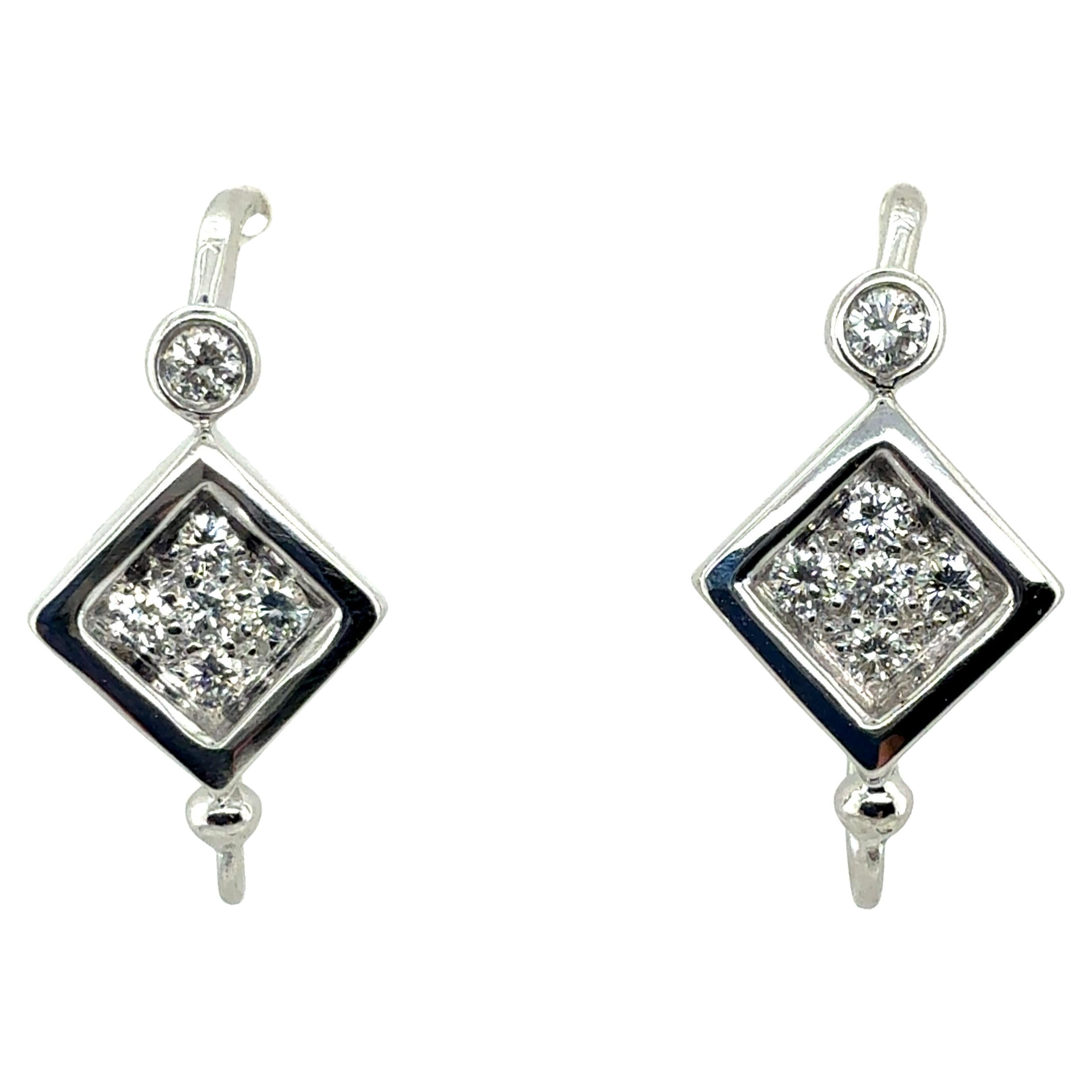 Retro White Gold 0.6 Carat Natural Colorless Diamond Earrings, Circa 1980 For Sale