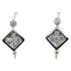 Retro White Gold 0.6 Carat Natural Colorless Diamond Earrings, Circa 1980